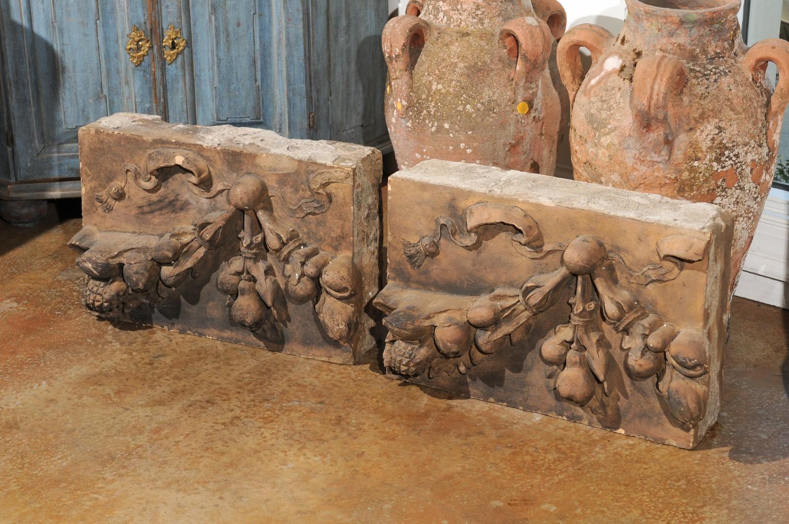 A pair of French second Empire terracotta architectural fragments from the mid-19th century with fruit motifs. We currently have two pairs available, priced and sold per pair. Born in France during the reign of France's last Emperor Napoleon III,