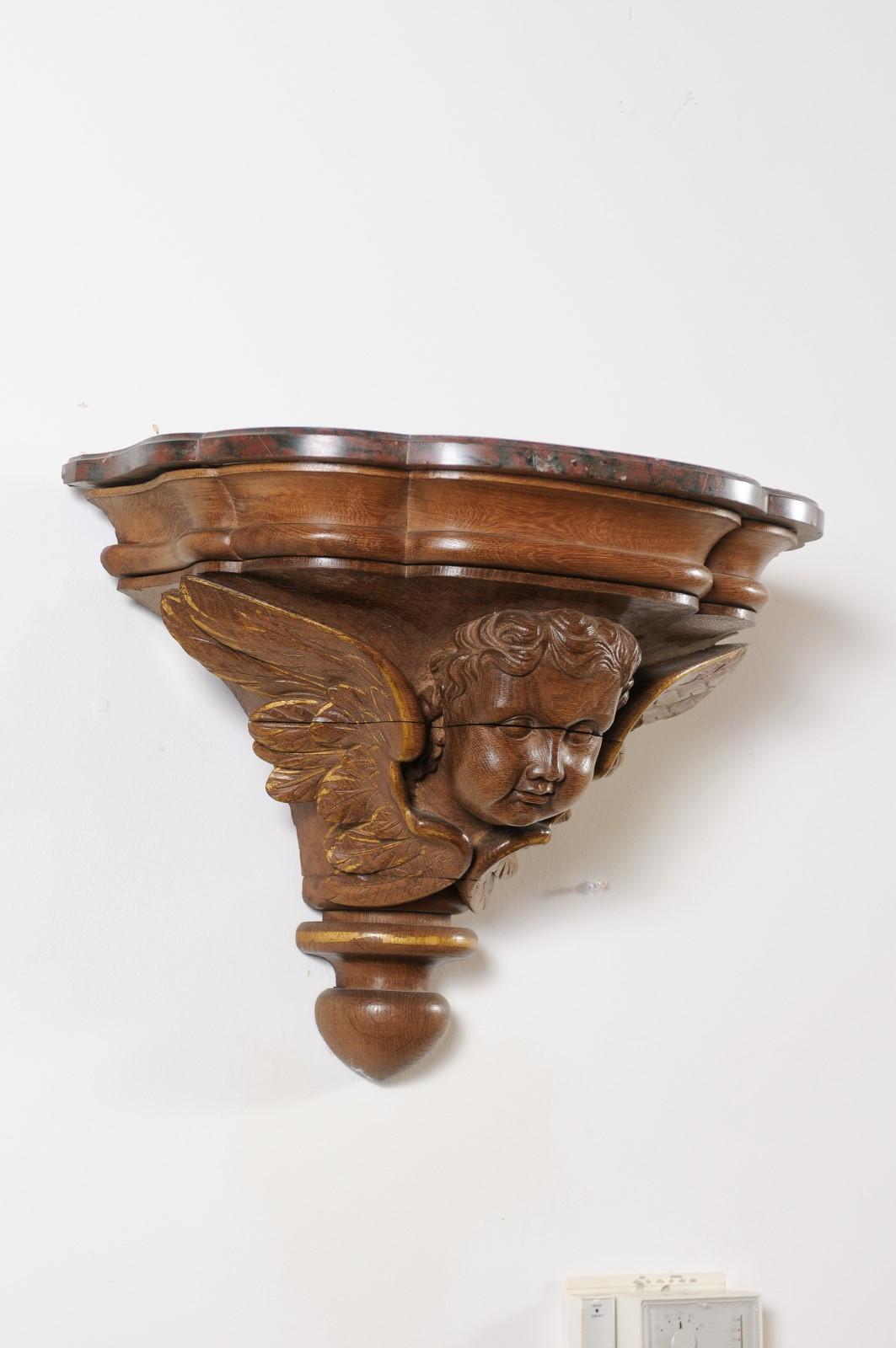 Pair of French 1880s Carved Walnut Brackets with Cherubs and Faux Marble Tops For Sale 6
