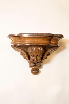 Pair of French 1880s Carved Walnut Brackets with Cherubs and Faux Marble Tops