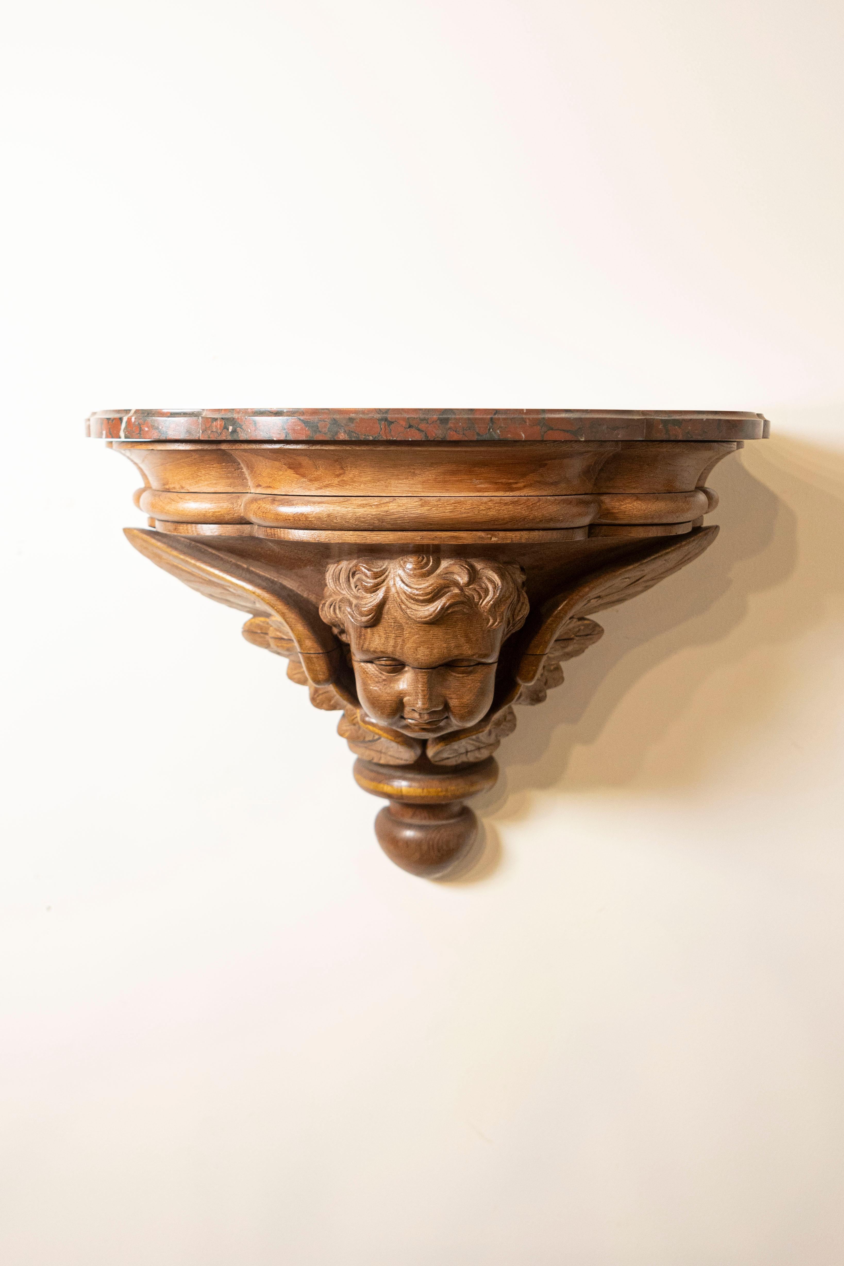 Pair of French 1880s Carved Walnut Brackets with Cherubs and Faux Marble Tops In Good Condition For Sale In Atlanta, GA