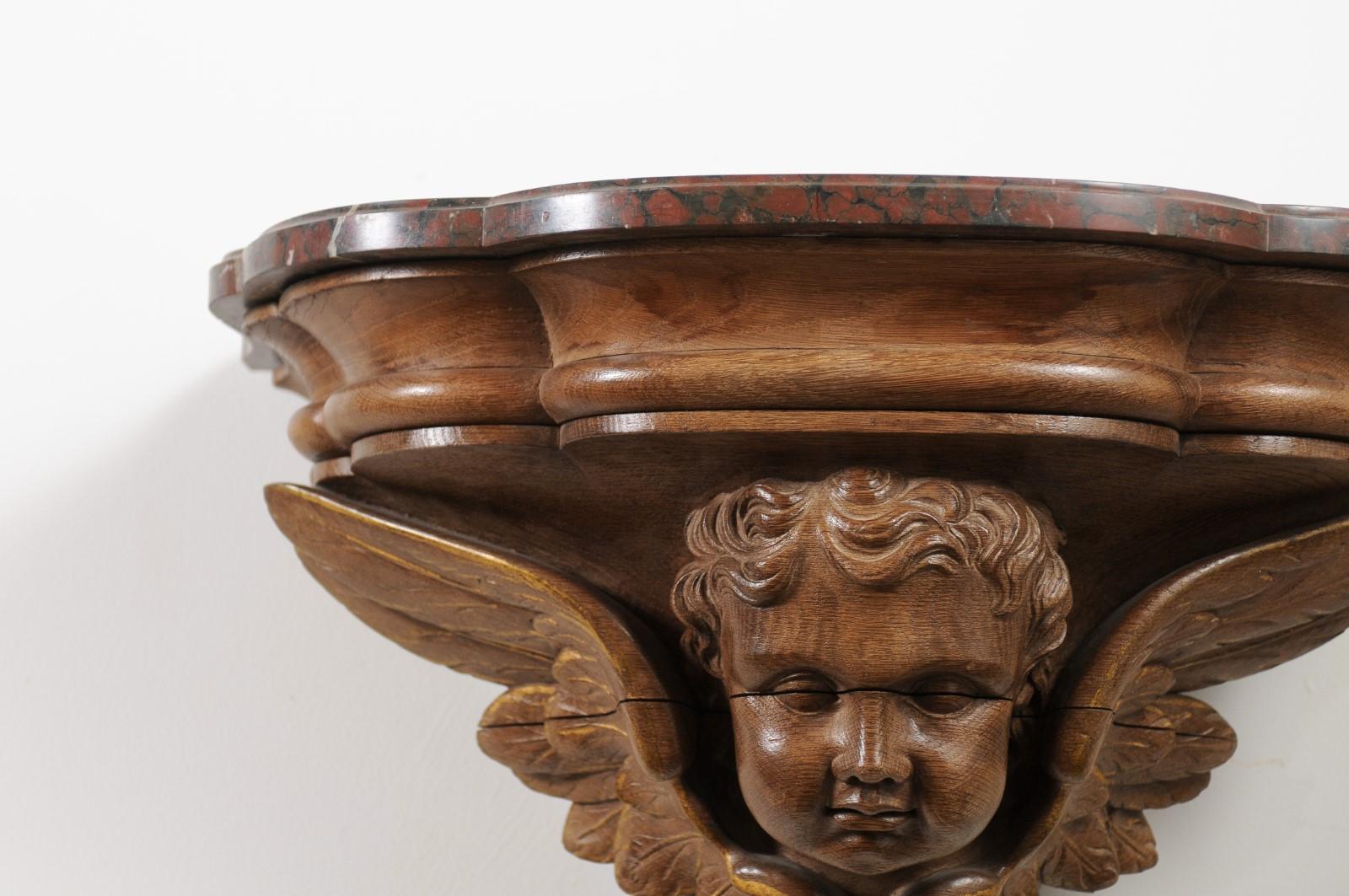19th Century Pair of French 1880s Carved Walnut Brackets with Cherubs and Faux Marble Tops For Sale