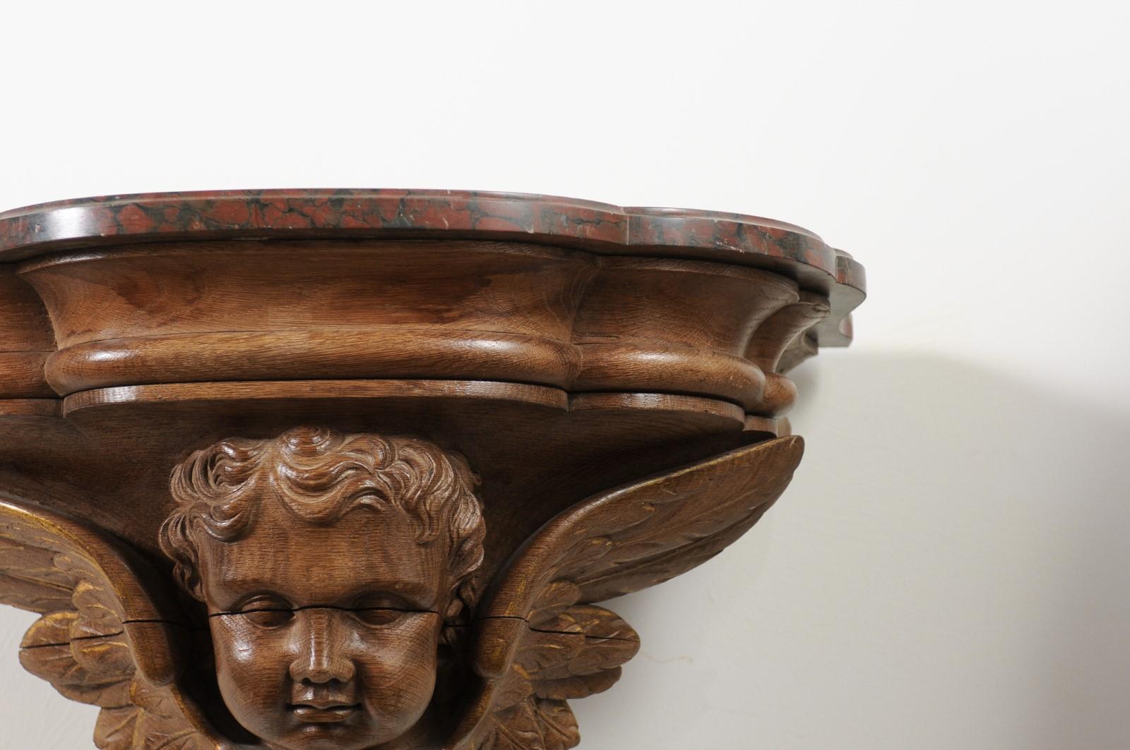 Pair of French 1880s Carved Walnut Brackets with Cherubs and Faux Marble Tops For Sale 1