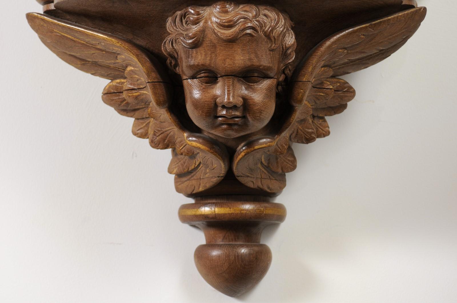 Pair of French 1880s Carved Walnut Brackets with Cherubs and Faux Marble Tops For Sale 2