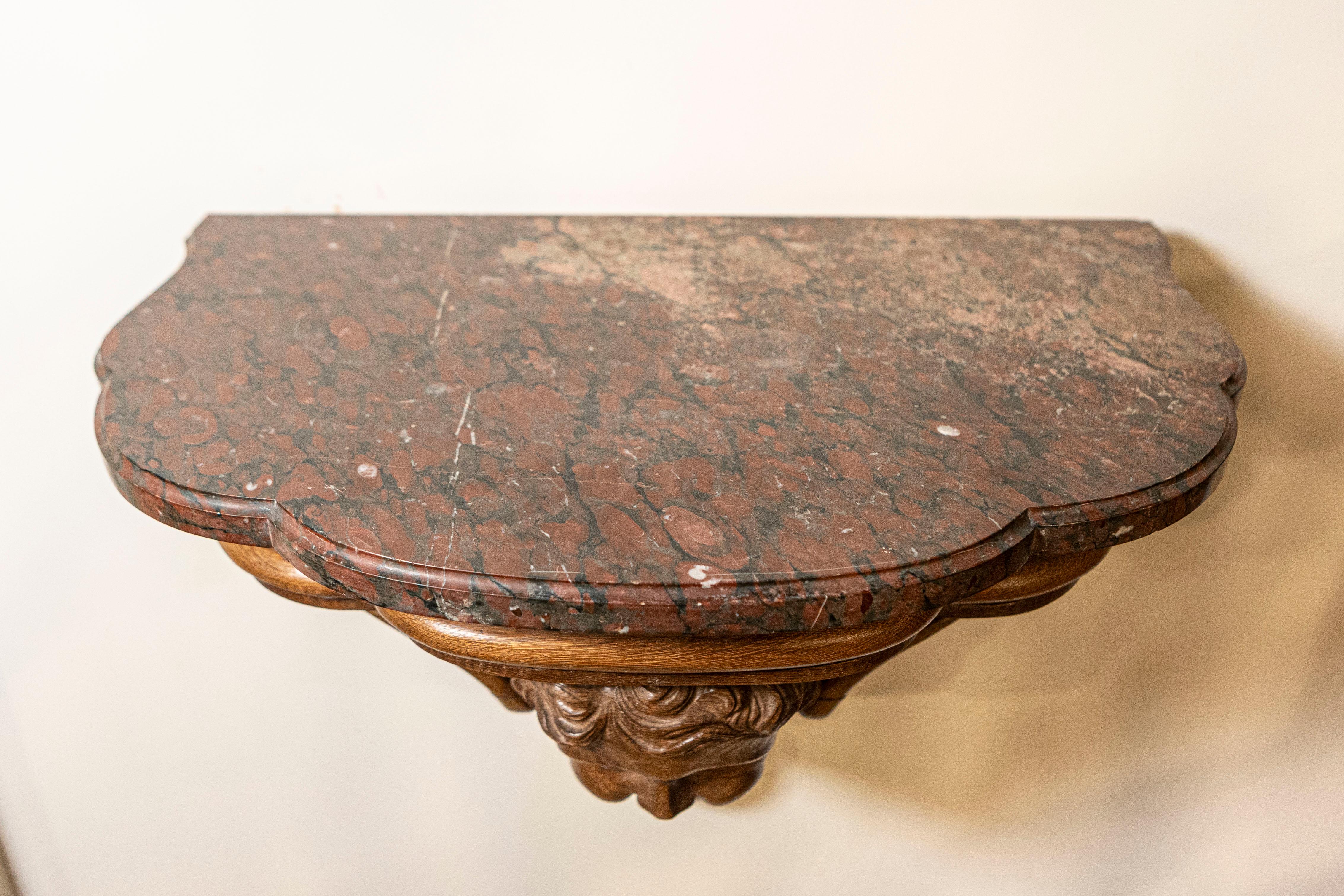 Pair of French 1880s Carved Walnut Brackets with Cherubs and Faux Marble Tops For Sale 3