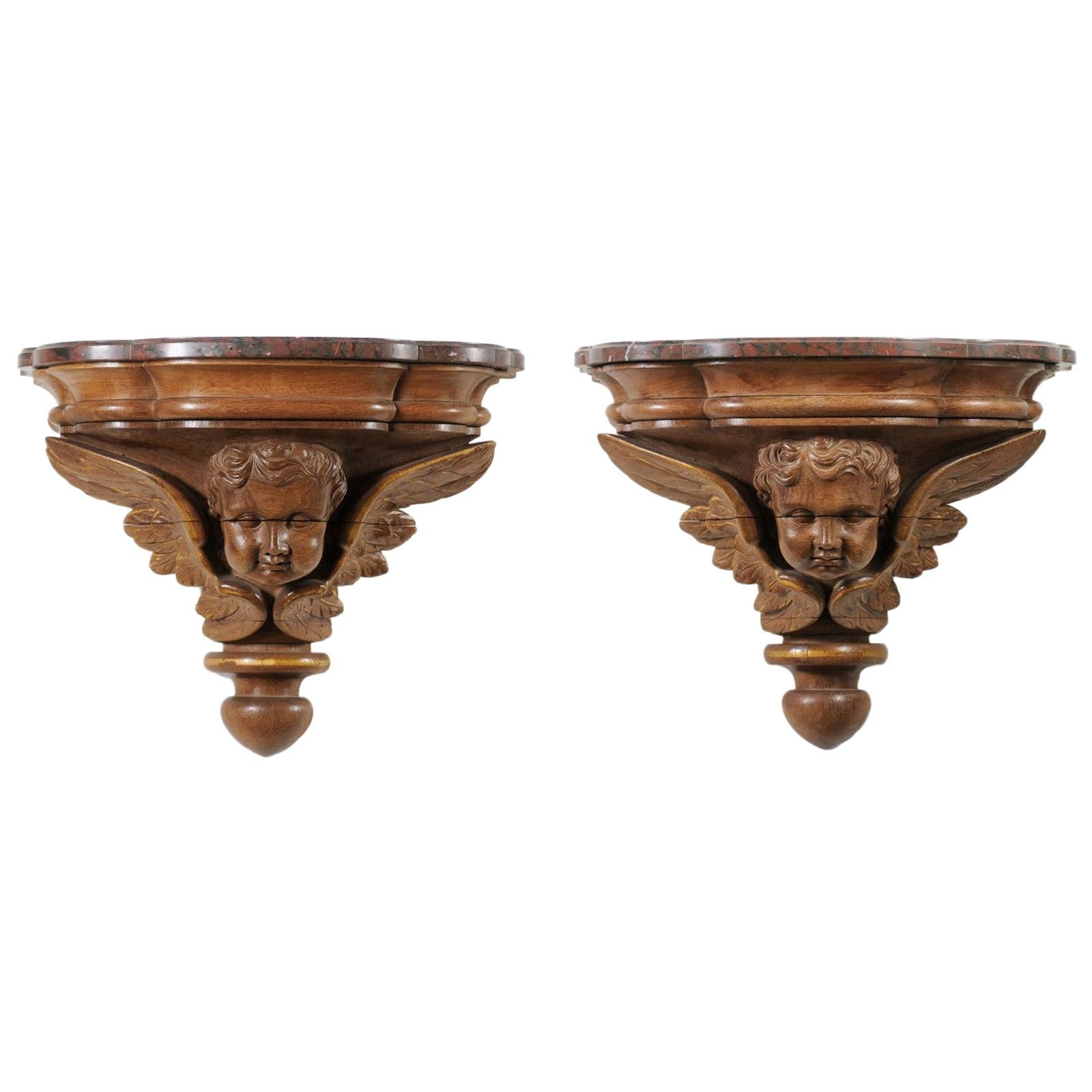 Pair of French 1880s Carved Walnut Brackets with Cherubs and Faux Marble Tops