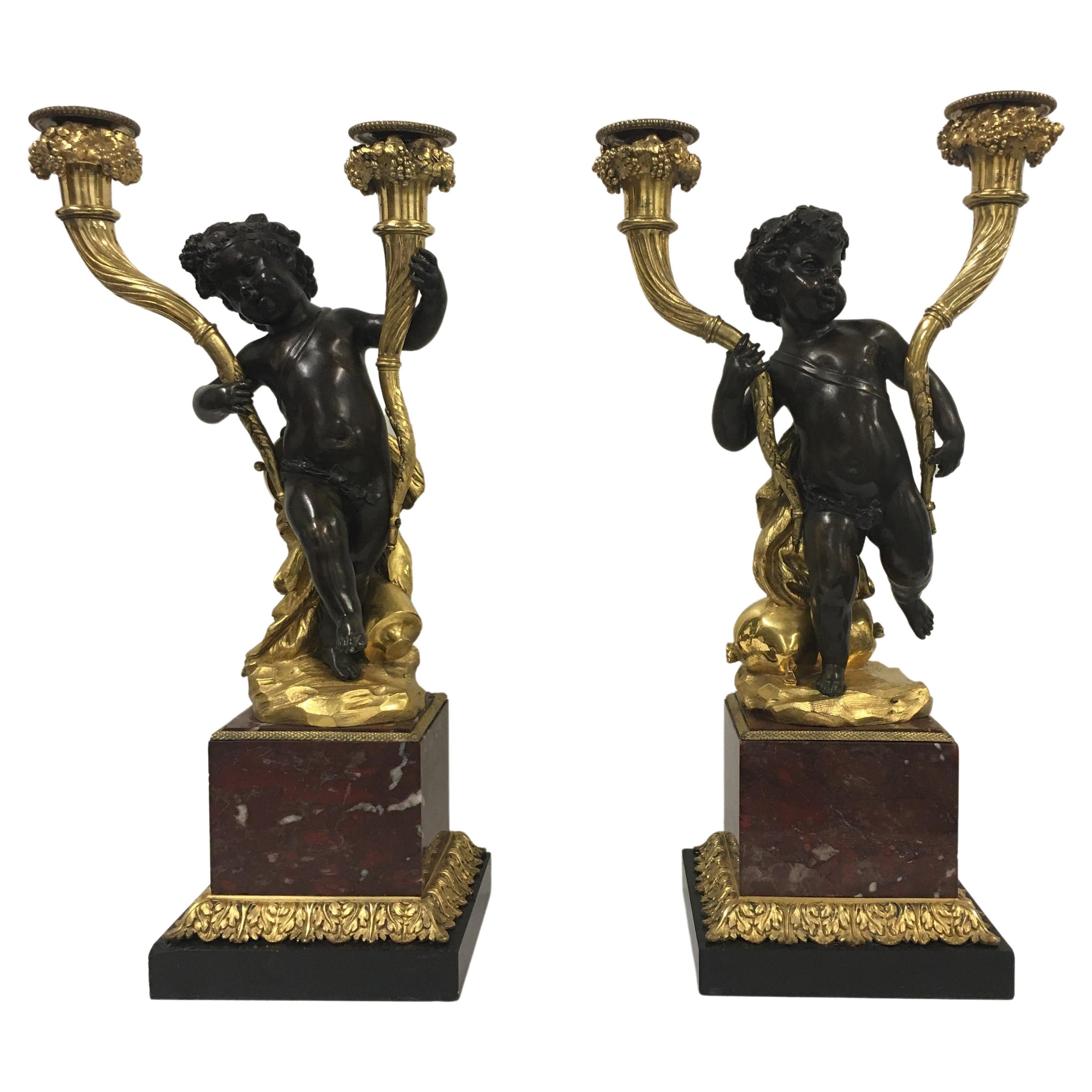 Pair of French 18th c. Louis XV mercury gilt and patinated bronze candelabras