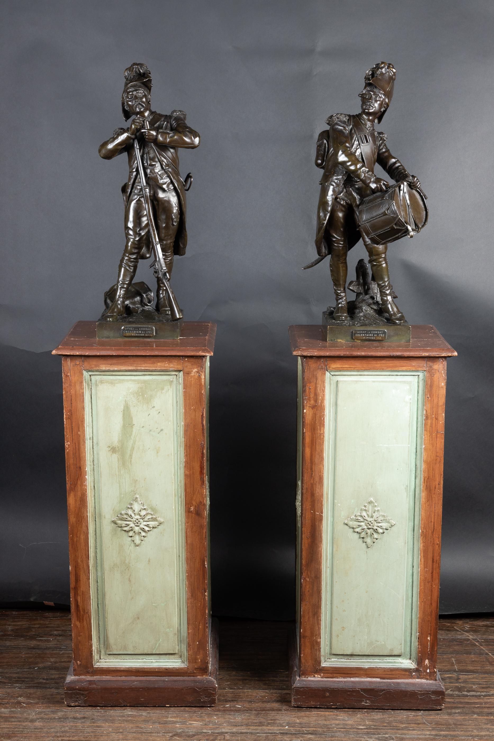 Fine 18th Century bronze figures of a military drummer and a soldier loading his musket. Both bronzes are placed on a square shallow plinth base with titled plaques and are signed to the side H. Dumaige

The soldier with drum features a plaque that