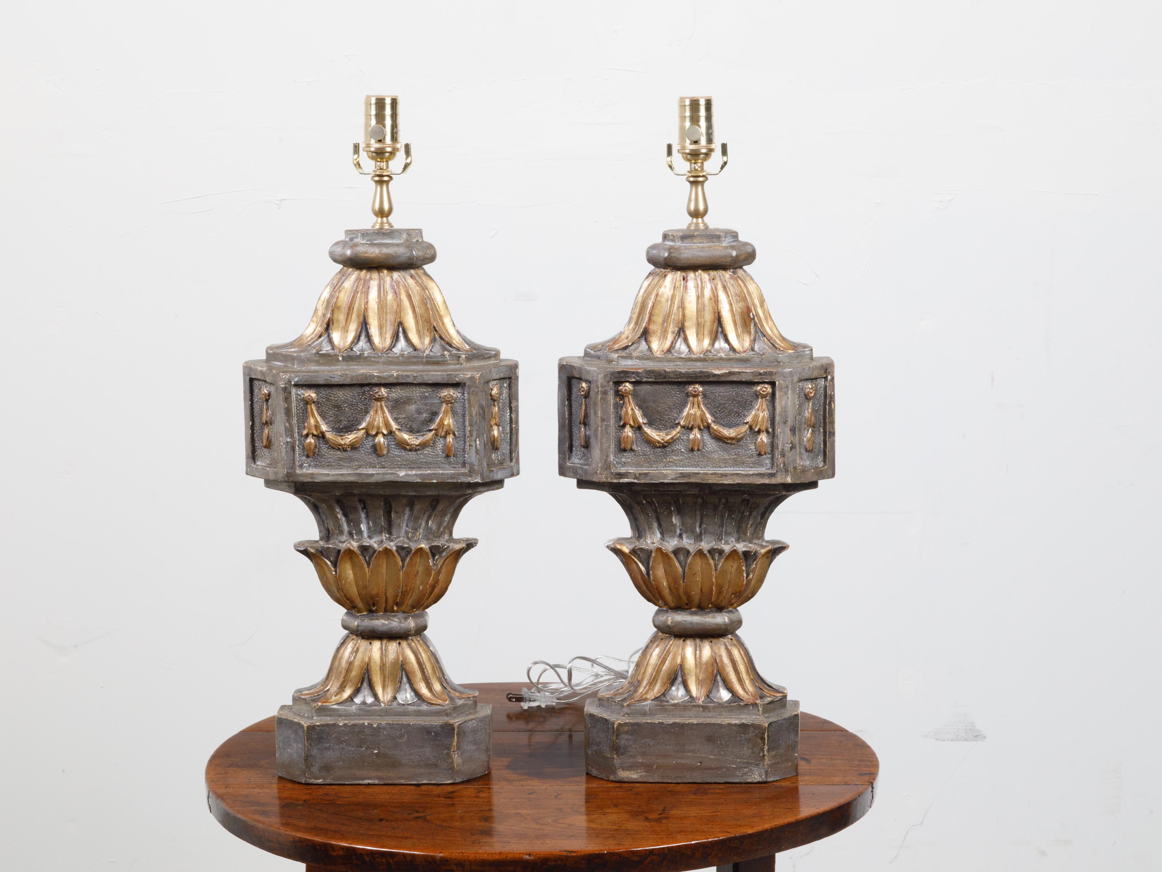 A pair of French carved and gilt wooden fragments from the 18th century, made into table lamps. Created in France during the 18th century, each of this pair of architectural fragments was mounted into a table lamp wired for the US. Showcasing carved
