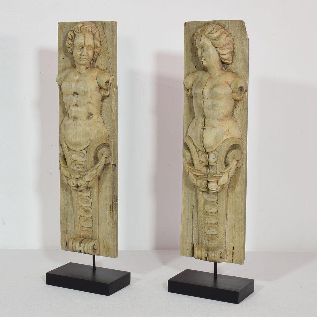 Beautiful weathered panels representing two caryatids.

France circa 1750, weathered, losses and old repairs.
Measurements individual and include the wooden base.