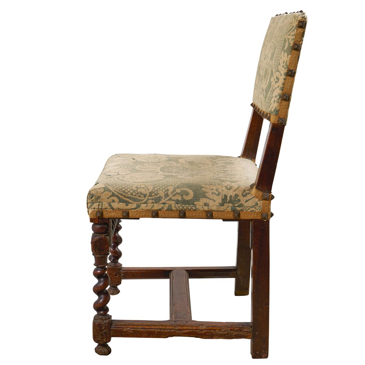 Discovered in France, these 18th-century hall chairs are notable for their wonderful carved frames, elegant damask upholstery and pyramid-shaped nailhead trim. This go-anywhere pair is useful, versatile and elegant.