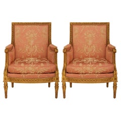 pair of French 18th century Louis XVI Period Giltwood Bergère armchairs