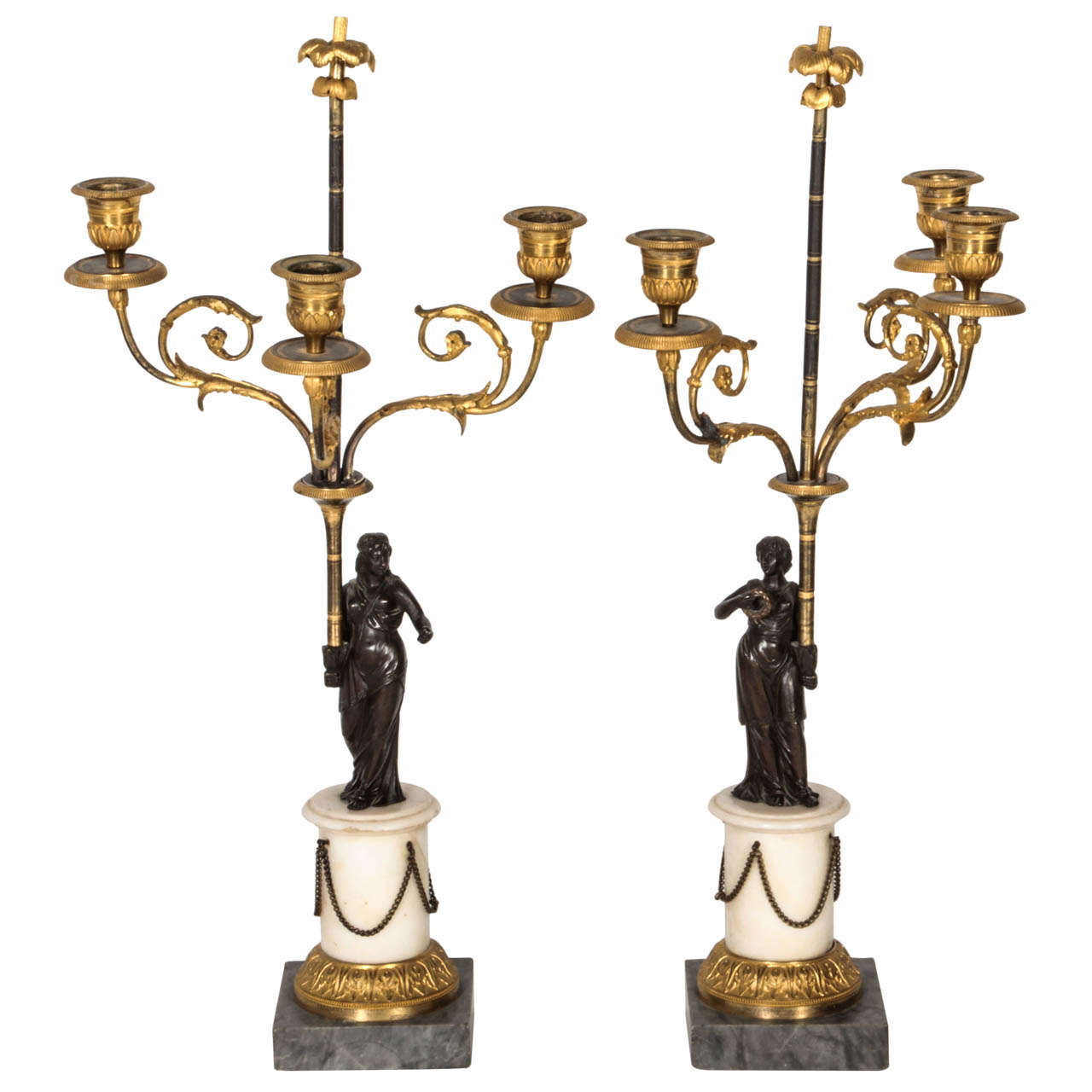 Pair of ormolu gilded and bronze three-armed candelabra.