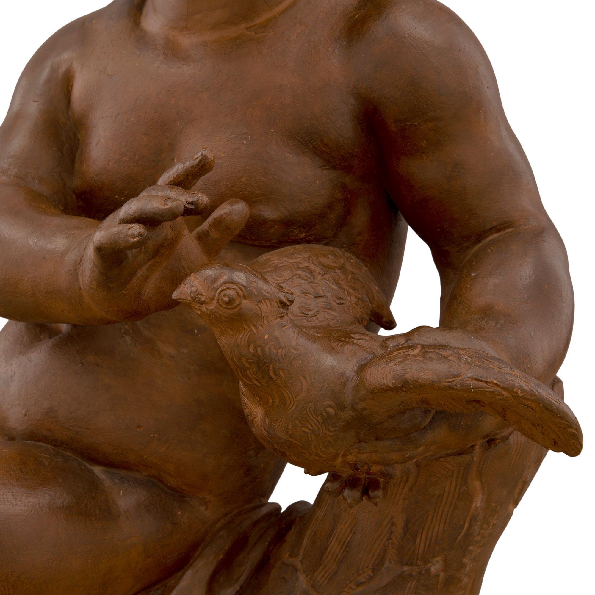 Terre cuite Paire de statues françaises en terre cuite du 18e siècle représentant des enfants jouant avec un oiseau en vente