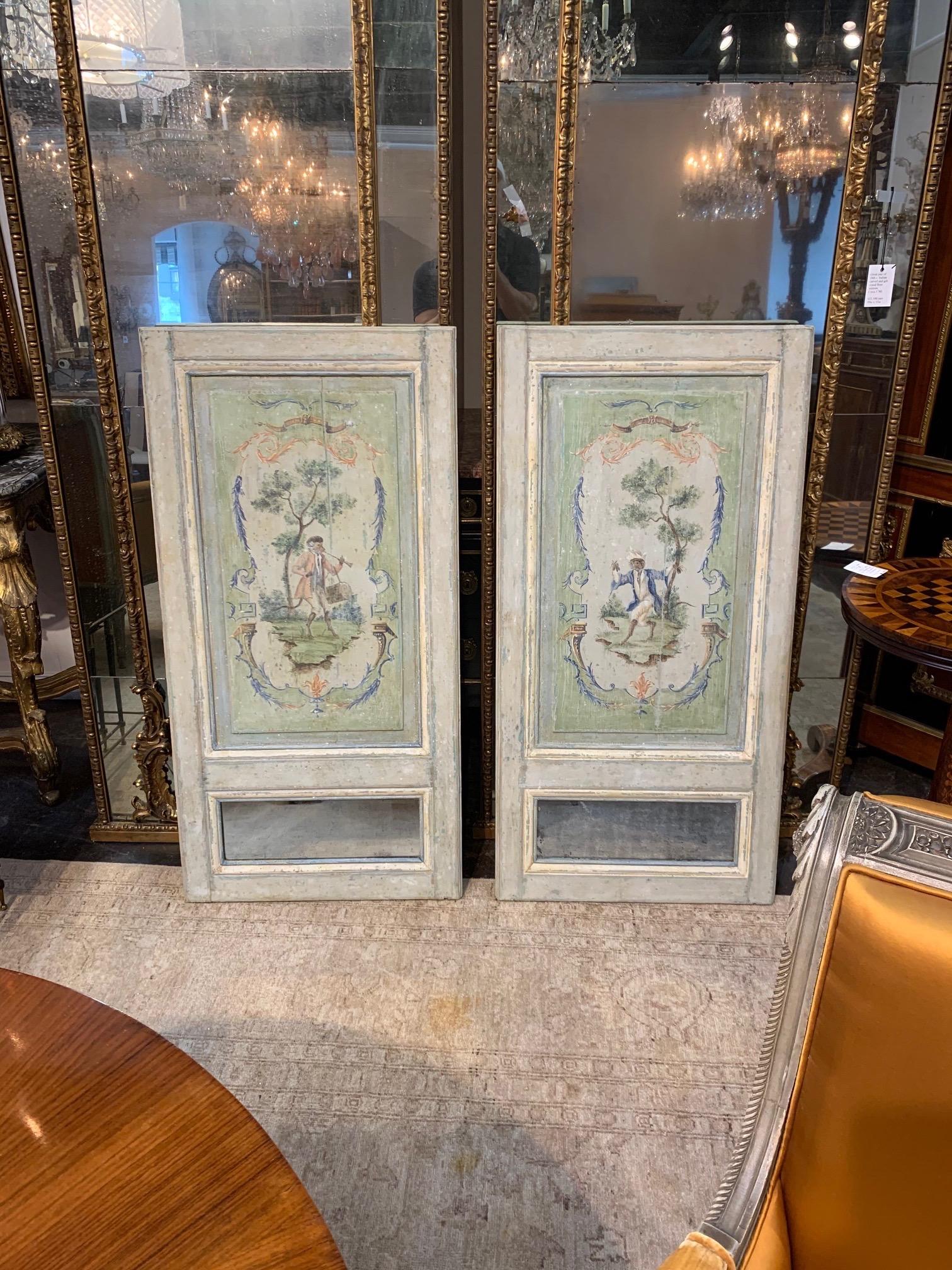 Beautiful pair of French 18th century Trumeau panels painted with monkeys. These have a lovely patina and small mirrors at the bottom. So interesting! A nice decorative accessory!
