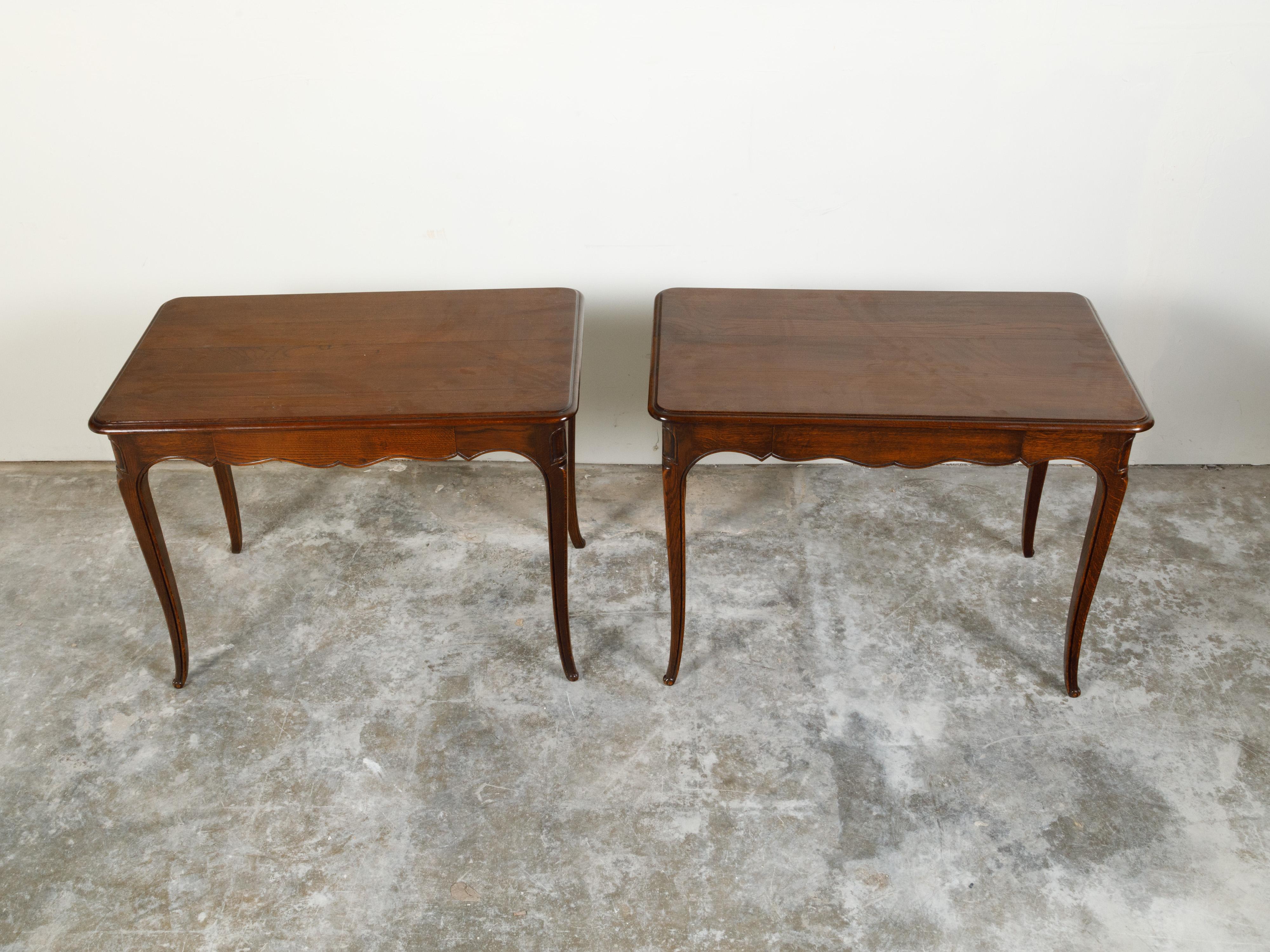 Carved Pair of French 1900s Oak Console Tables with Single Drawers and Scalloped Aprons