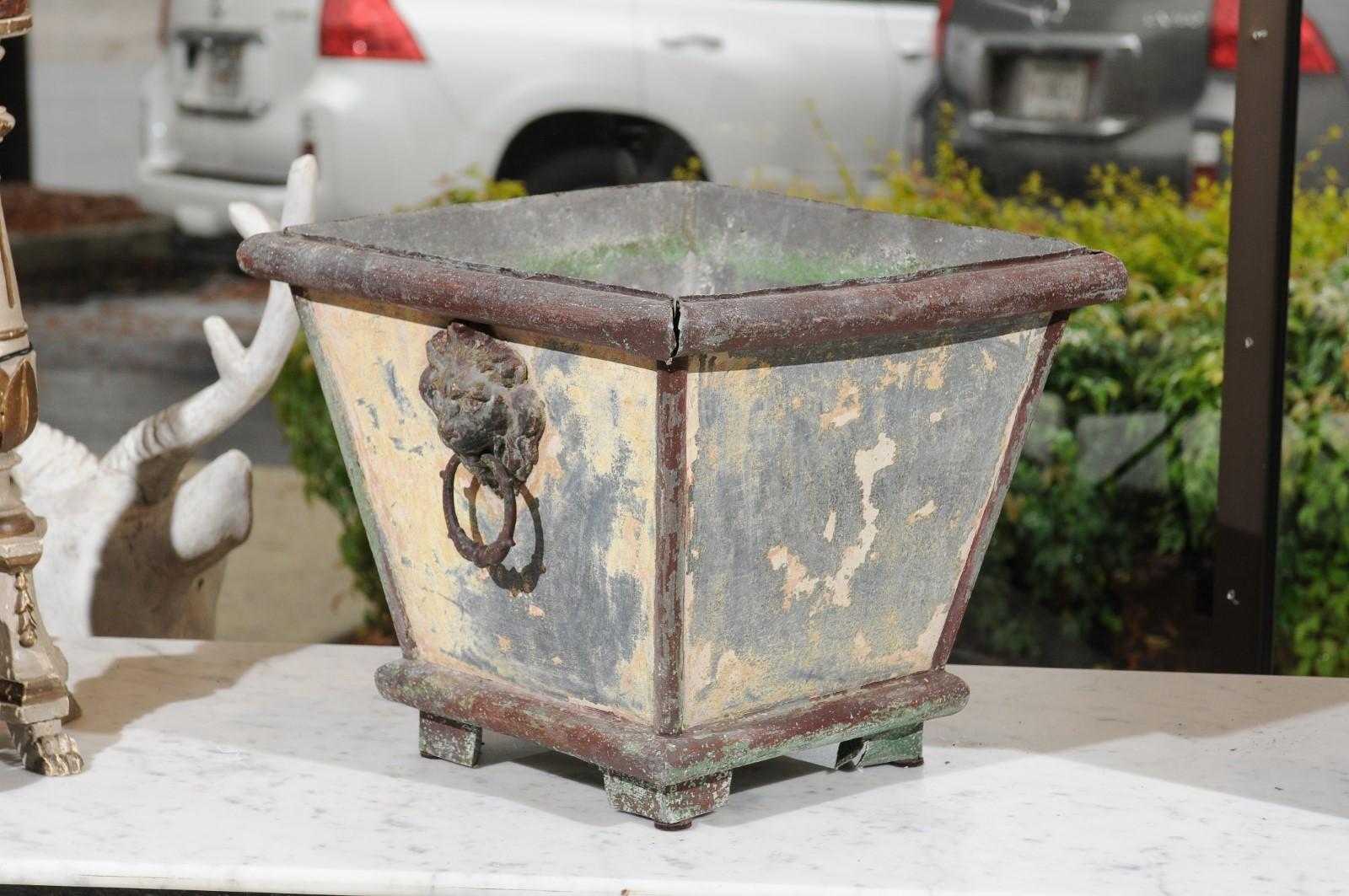 Pair of French 1900s Zinc Planters with Weathered Patina and Lion Head Motifs In Fair Condition In Atlanta, GA