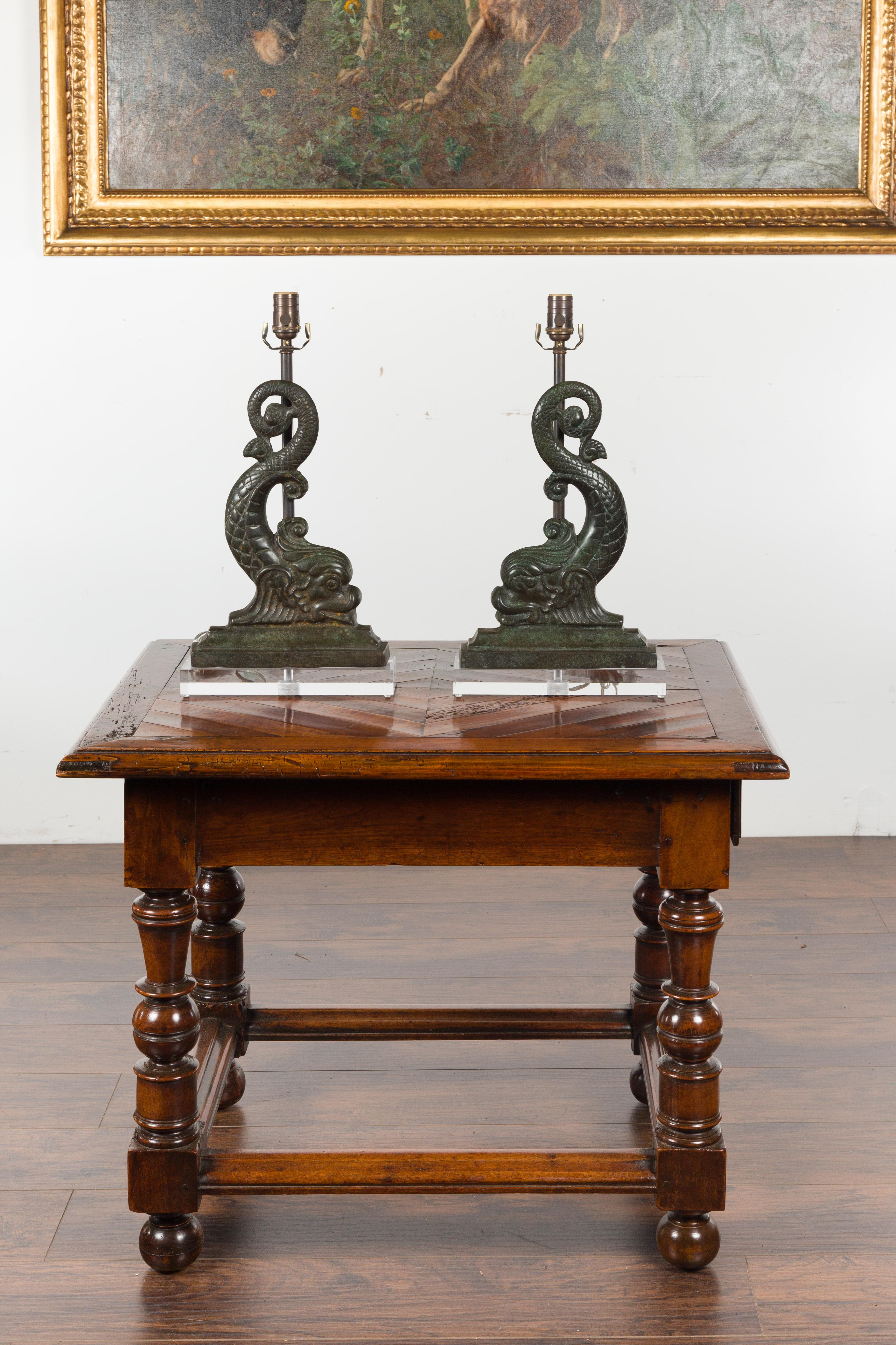 Pair of French 1920s Baroque Style Bronze Dolphins Mounted as Lamps on Lucite In Good Condition In Atlanta, GA
