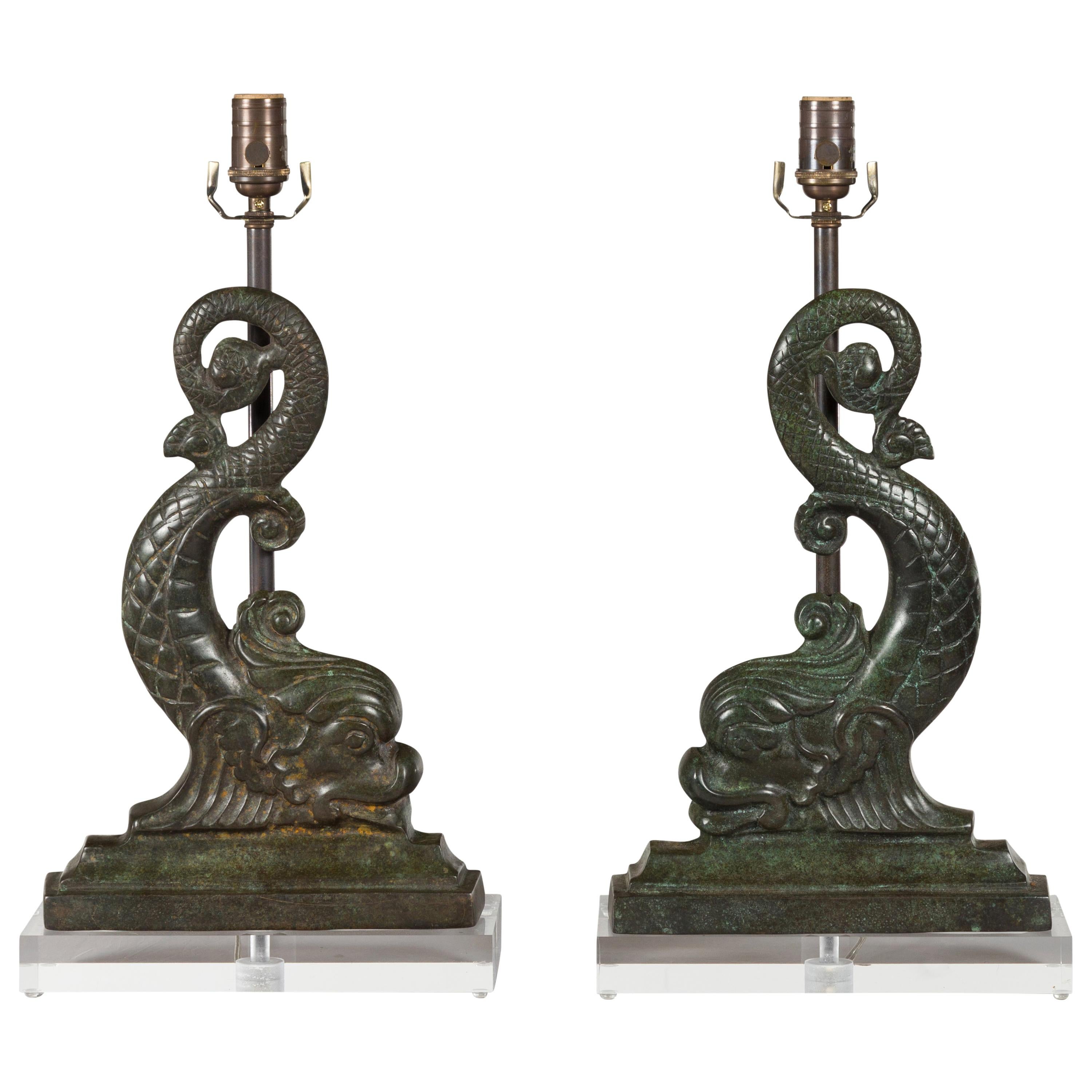 Pair of French 1920s Baroque Style Bronze Dolphins Mounted as Lamps on Lucite