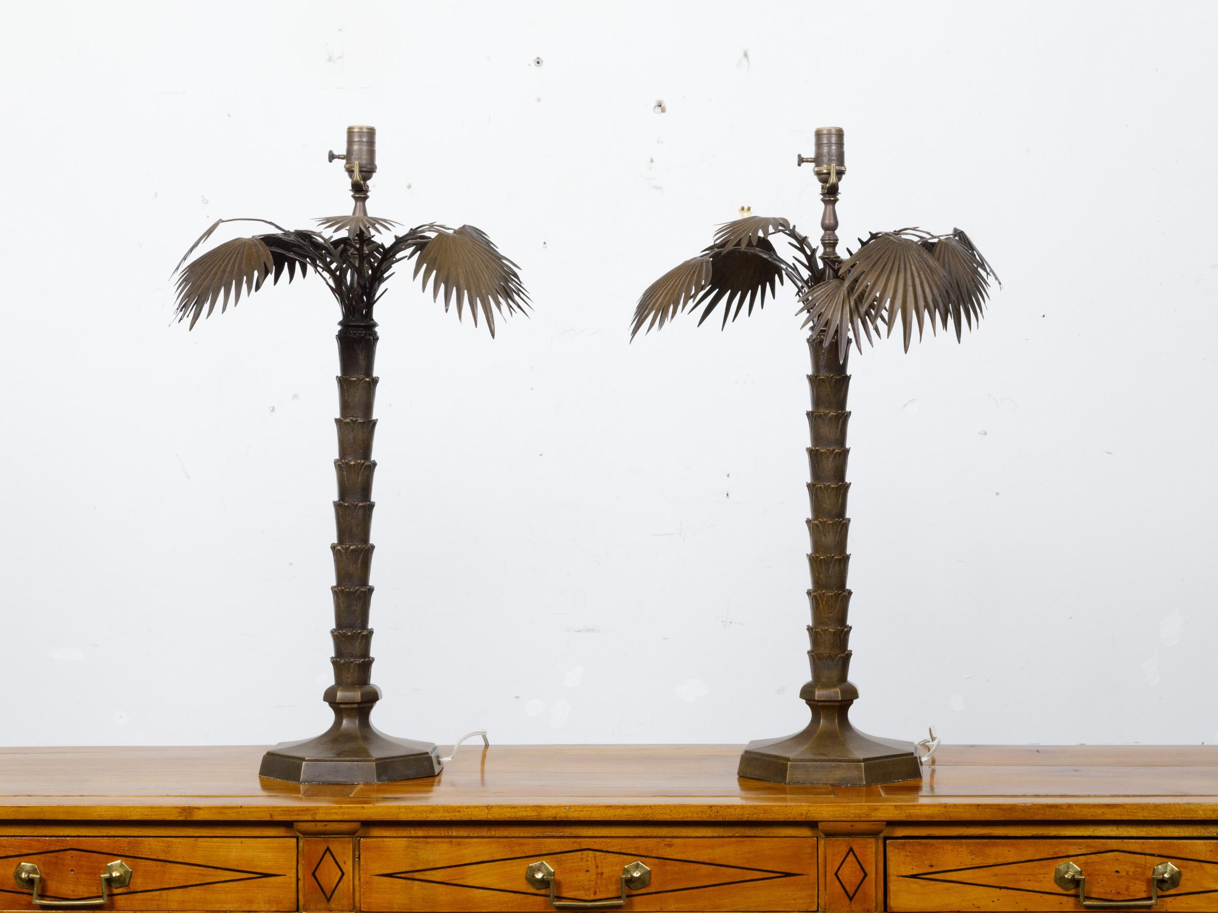 A pair of French bronze palm tree table lamps from circa 1920 on octagonal bases, rewired for the USA. This exquisite pair of French bronze palm tree table lamps from circa 1920 showcases a unique and elegant design, expertly capturing the essence