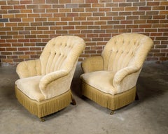 Pair of French 1920s Fauteuils Crapaud with Cream Upholstery, on Casters