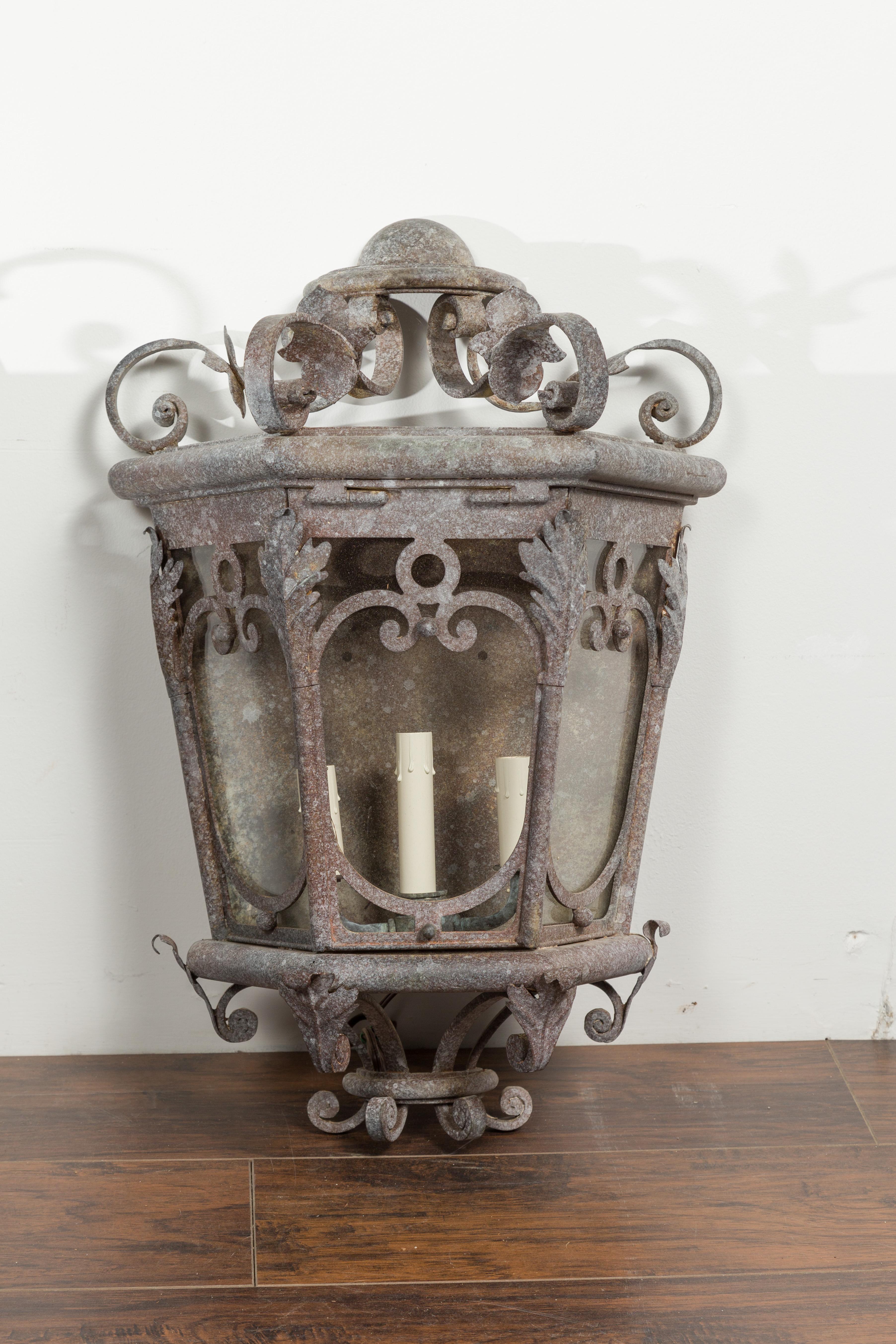 20th Century Pair of French 1920s Iron Three-Light Lanterns with Scrolling Motifs and Foliage For Sale