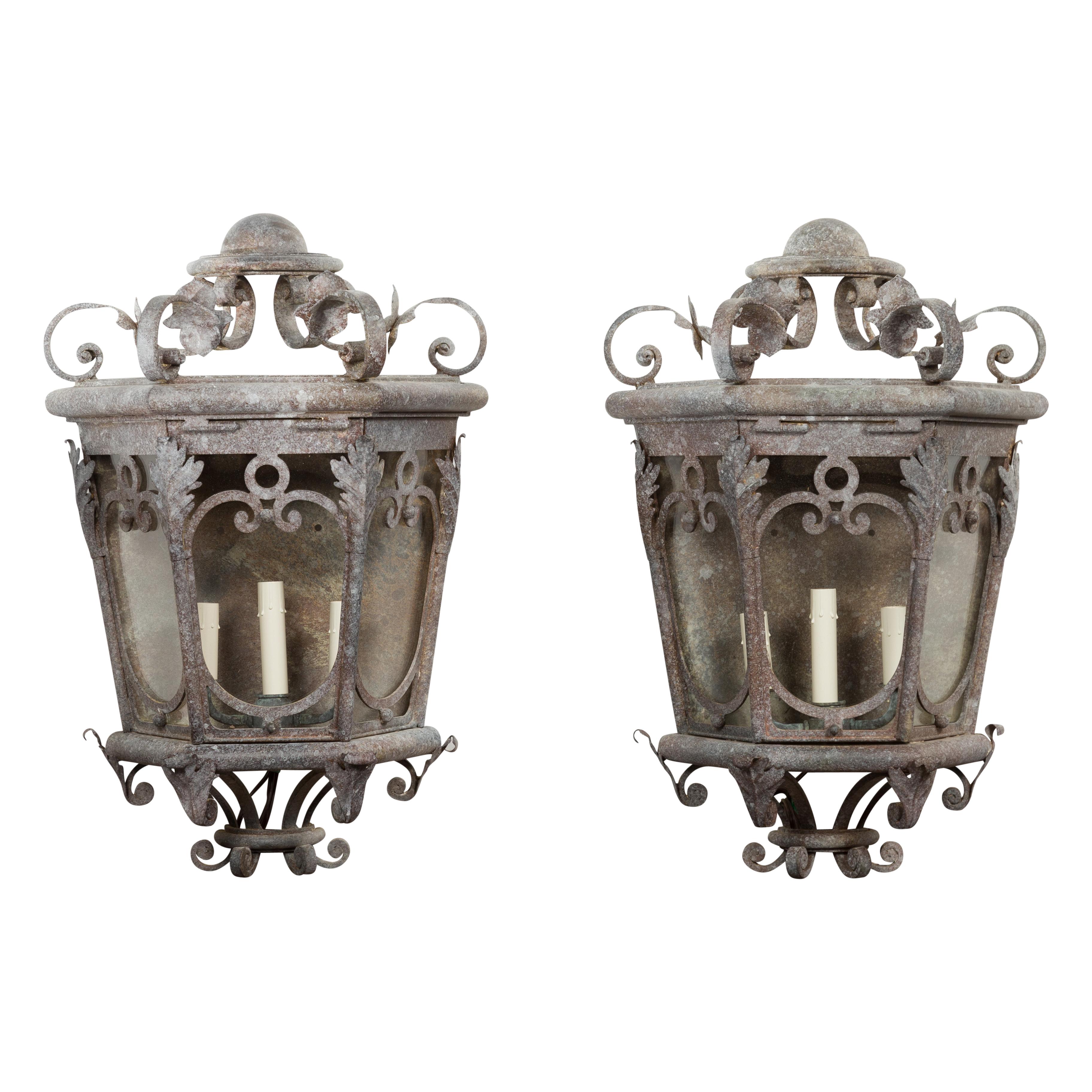 Pair of French 1920s Iron Three-Light Lanterns with Scrolling Motifs and Foliage
