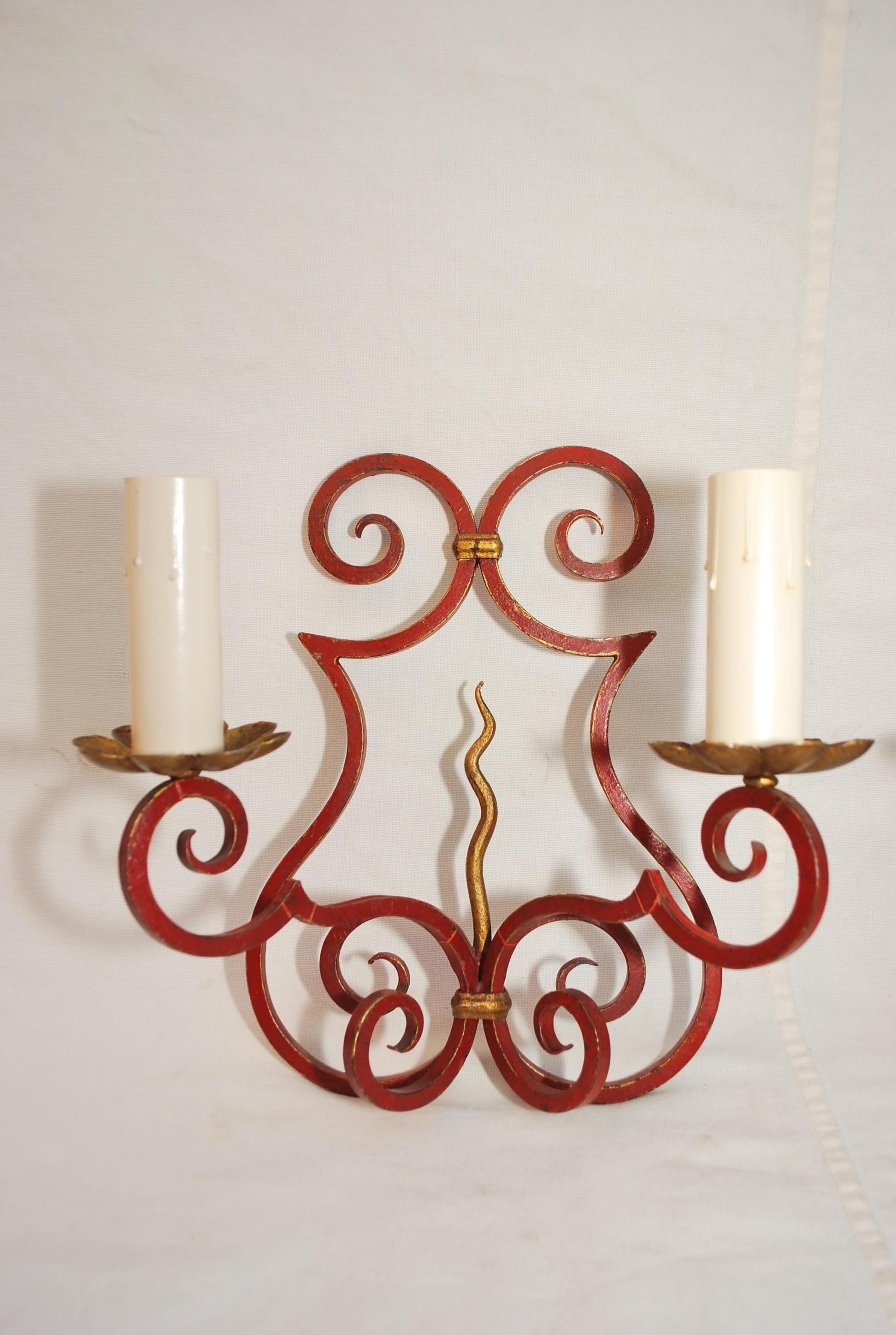 A beautiful pair of French hands crafted wrought iron sconces, the color is not so red, the color is so much nicer in person, especially the patina, the digital  camera distort the true beauty of the antique, if you need a back plate to fit the