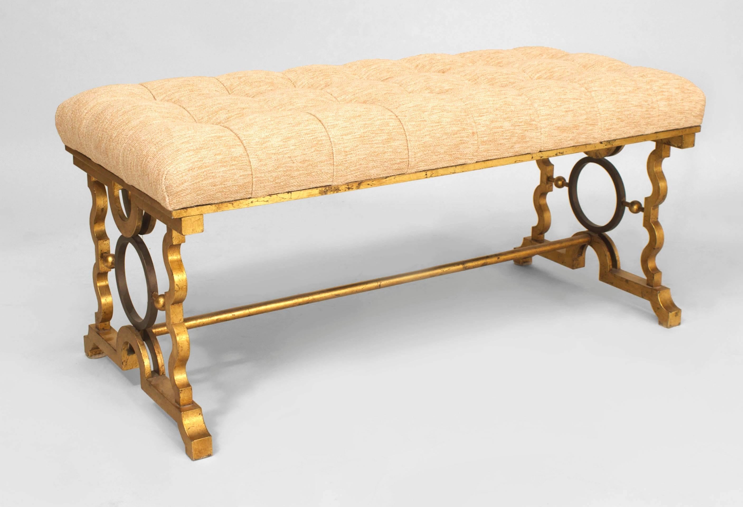 Pair of French 1940s style iron gold painted benches with open design & stretcher with tufted beige suede seat. (manner of GILBERT POILLERAT) (PRICED AS Pair).
