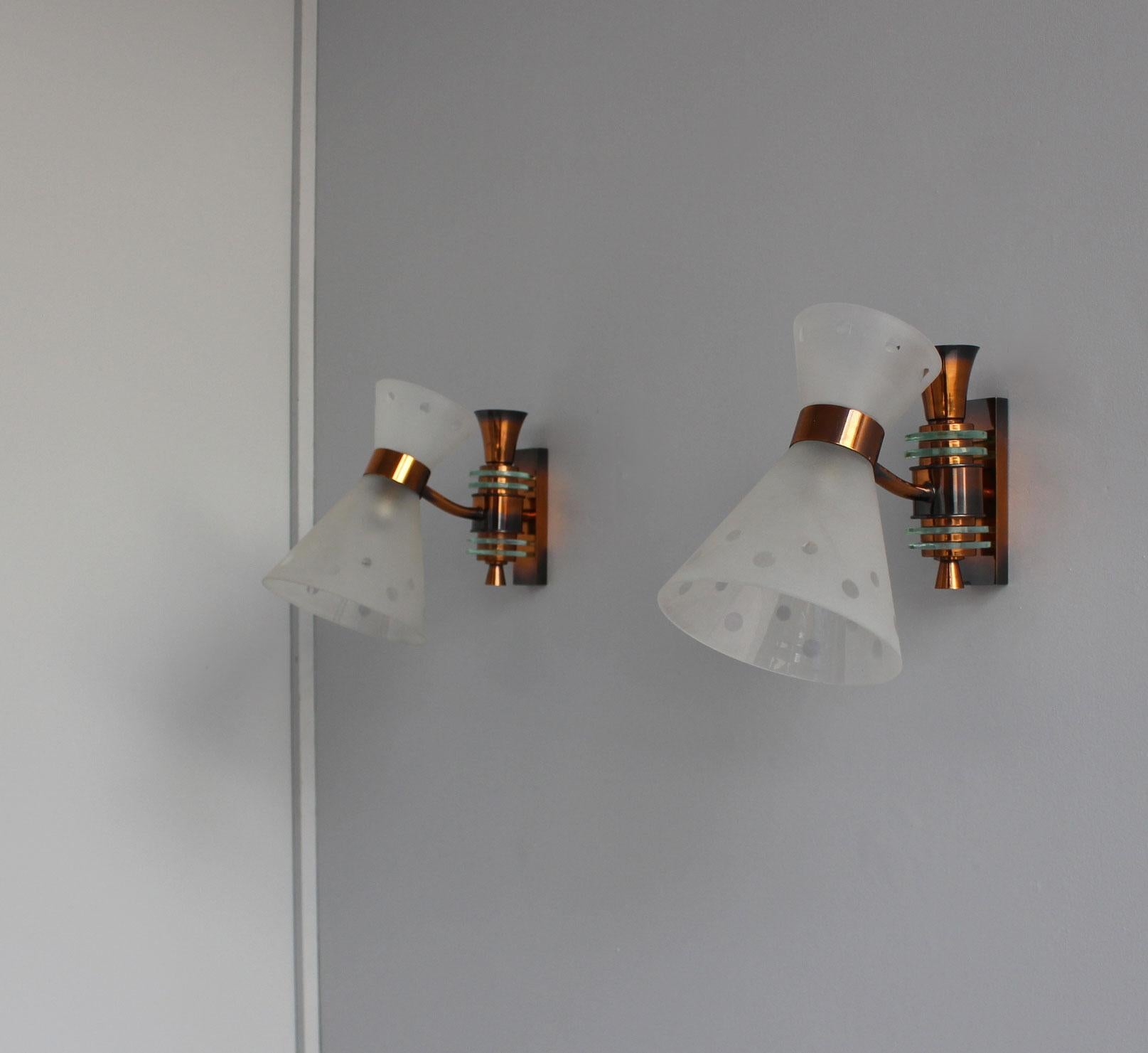 Pair of French mid-century patinated copper base wall lights with a diabolo shade and glass details.