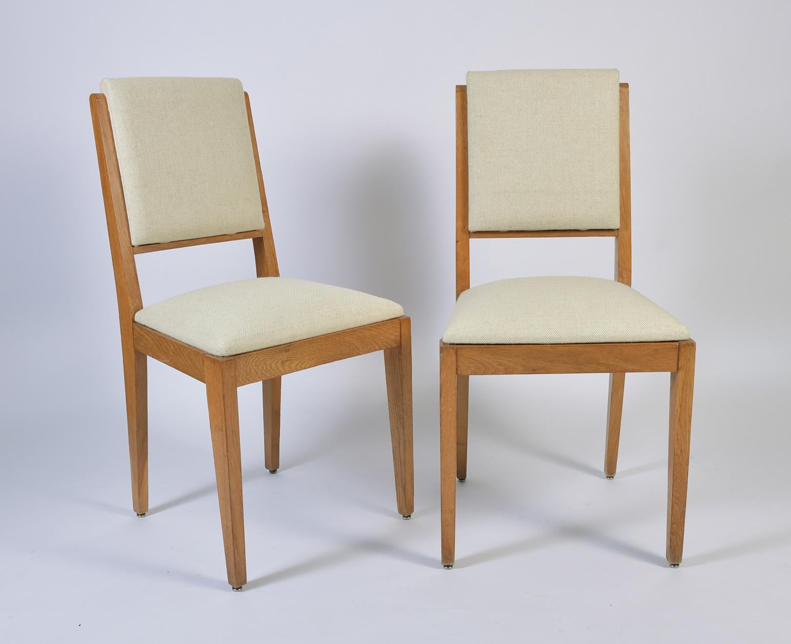 A pair of post-war blond oak chairs
France, circa 1950.
Newly upholstered in high quality tweed from Bute
(in total we have four armchairs and two chairs available).