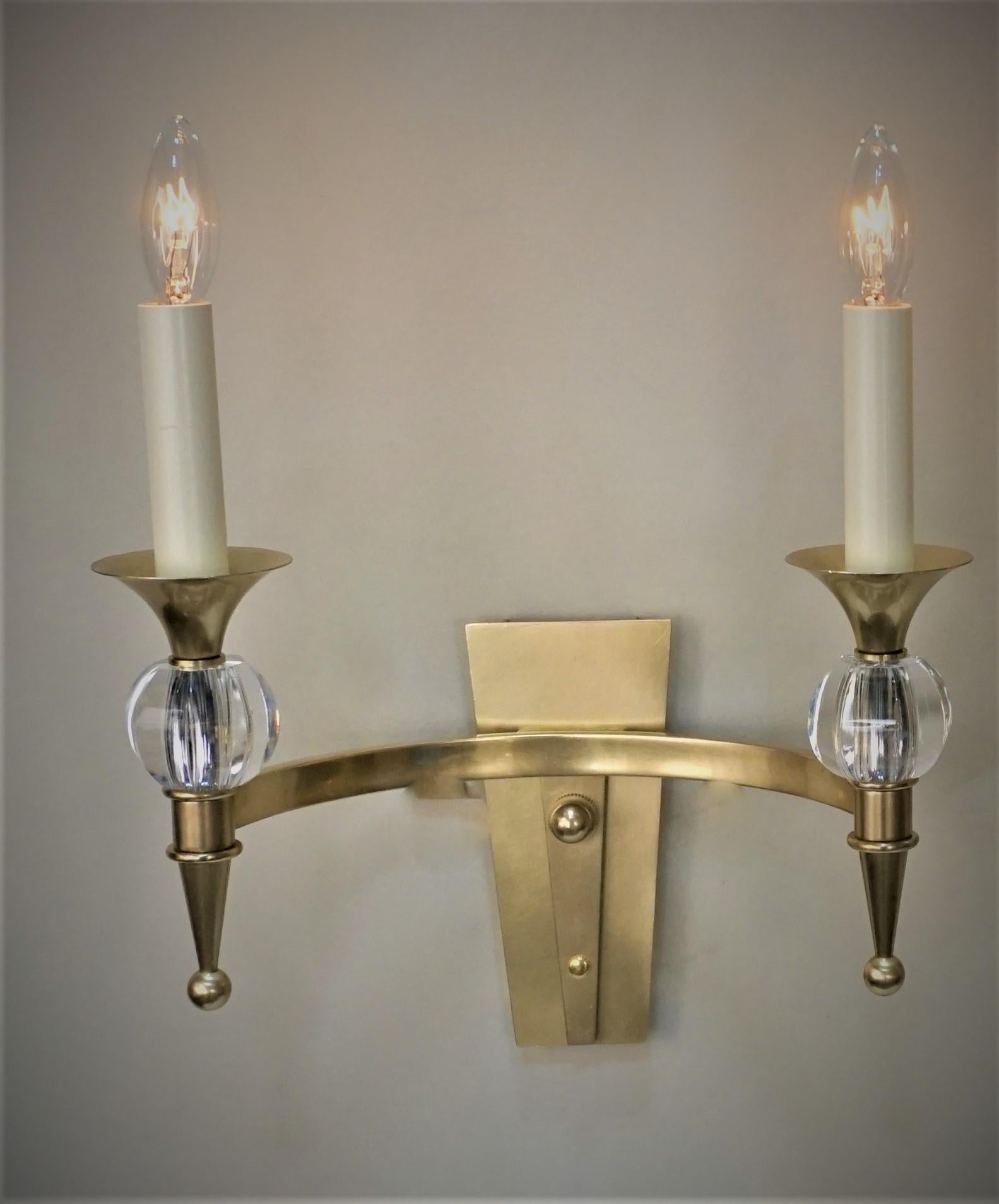 Pair of simple but elegant double arm bronze and crystal wall sconces.
Back of the back plate measurement: 2