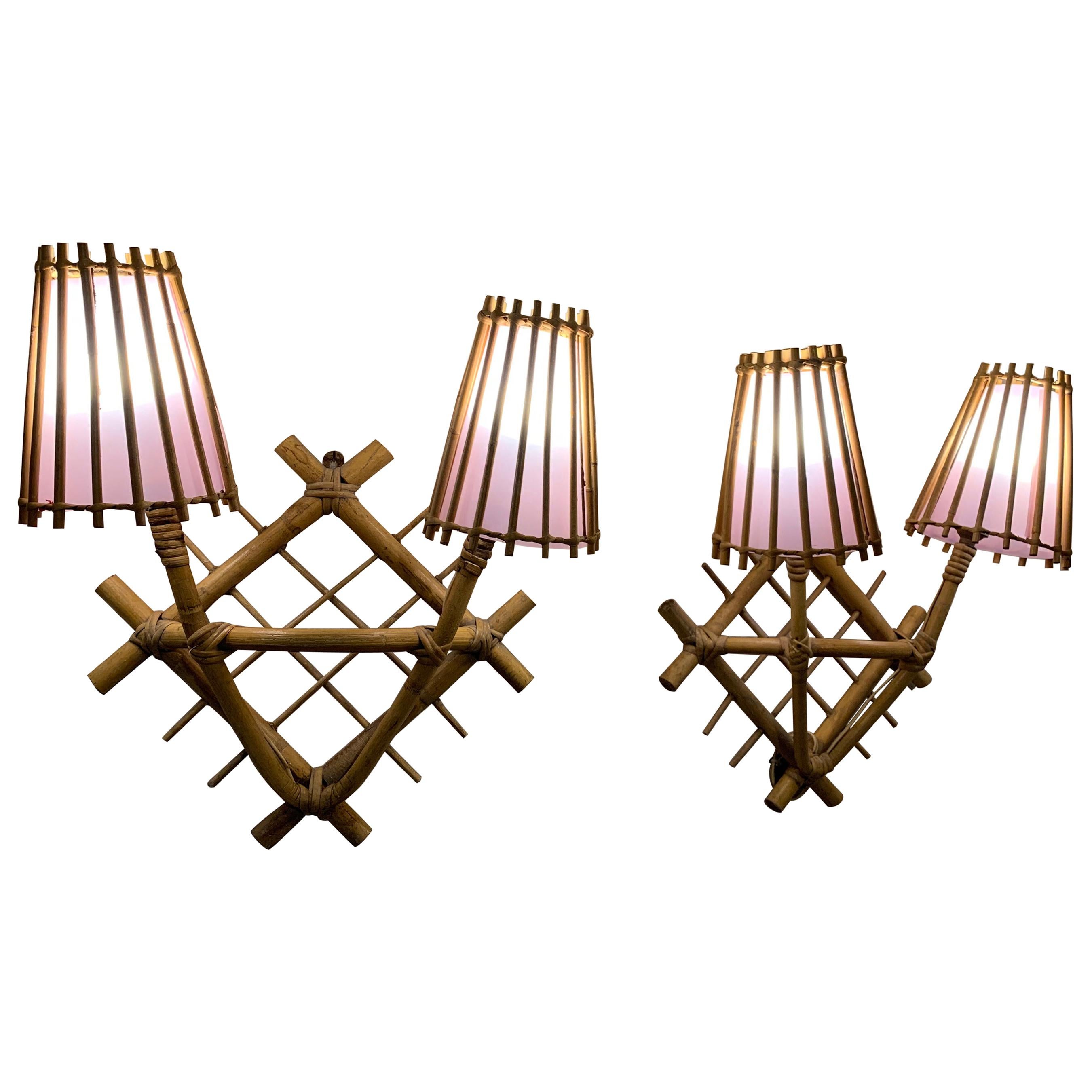 Pair of French 1960's Rattan Sconces by Louis Sognot with Light Pink Lampshades