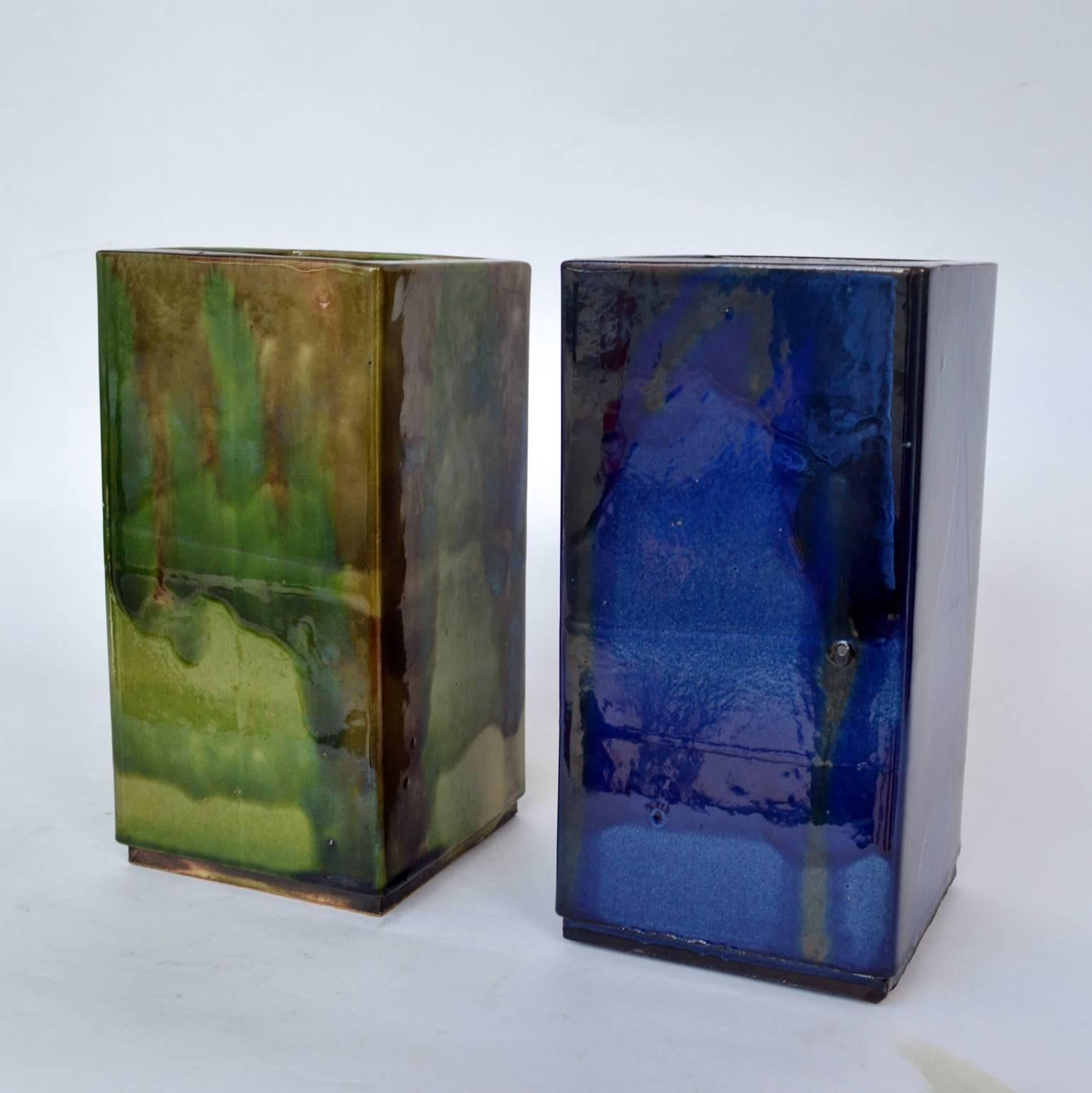Two mid-century square and handcrafted and hand painted glazed vases in blue and in green made in the Vailaris area in the south of France.