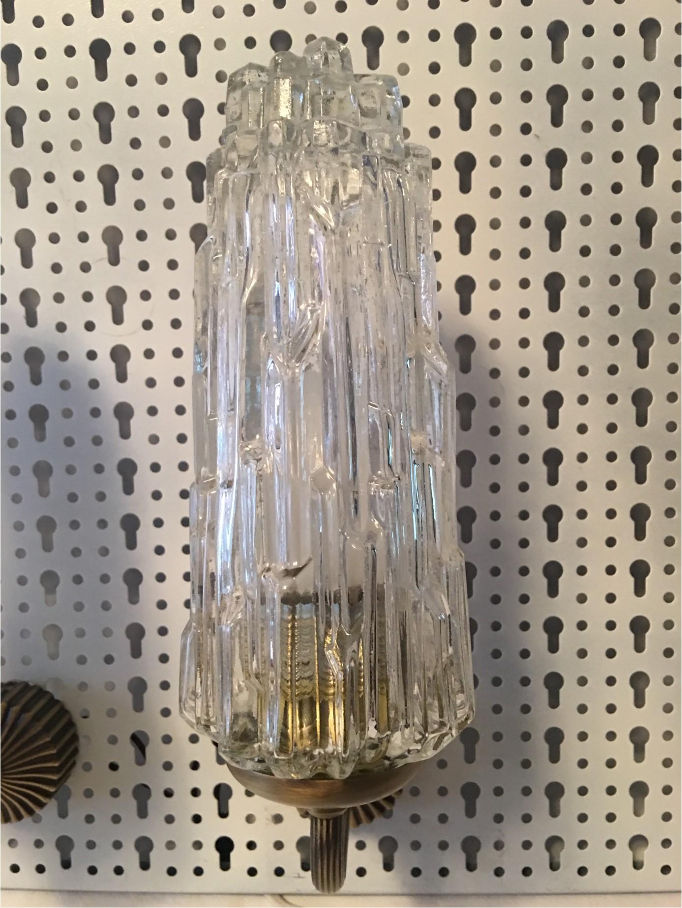 Charming pair of French 1970s brass and glass Art Deco style sconces. The delicate copper support stem gives an appearance of floating light fixtures. The wall attachment measures 2.25 inches. Each fixture requires one European E 14 Candelabra bulb