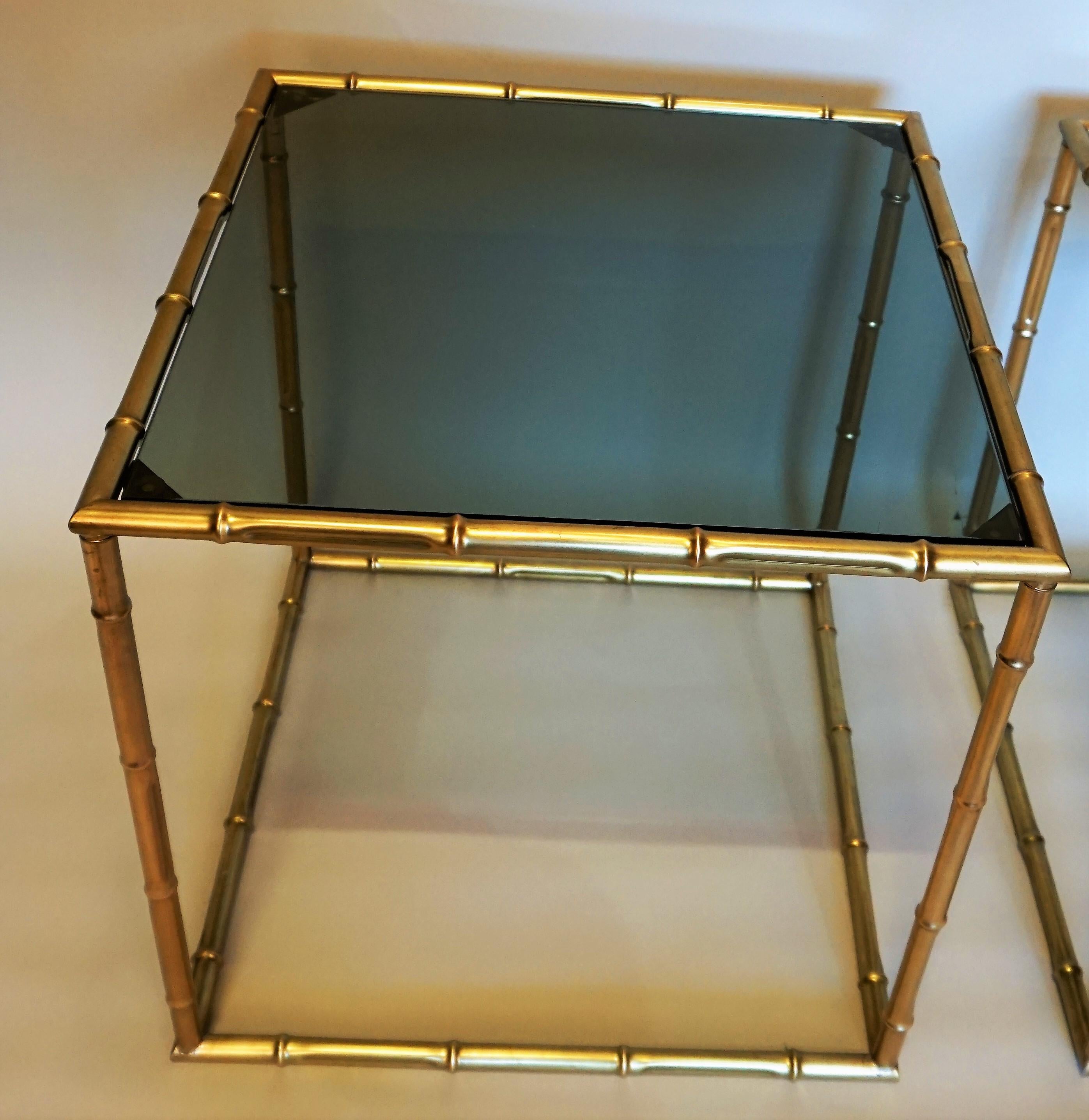 Pair of 1970s bronze faux bamboo end tables with smoked glass top.