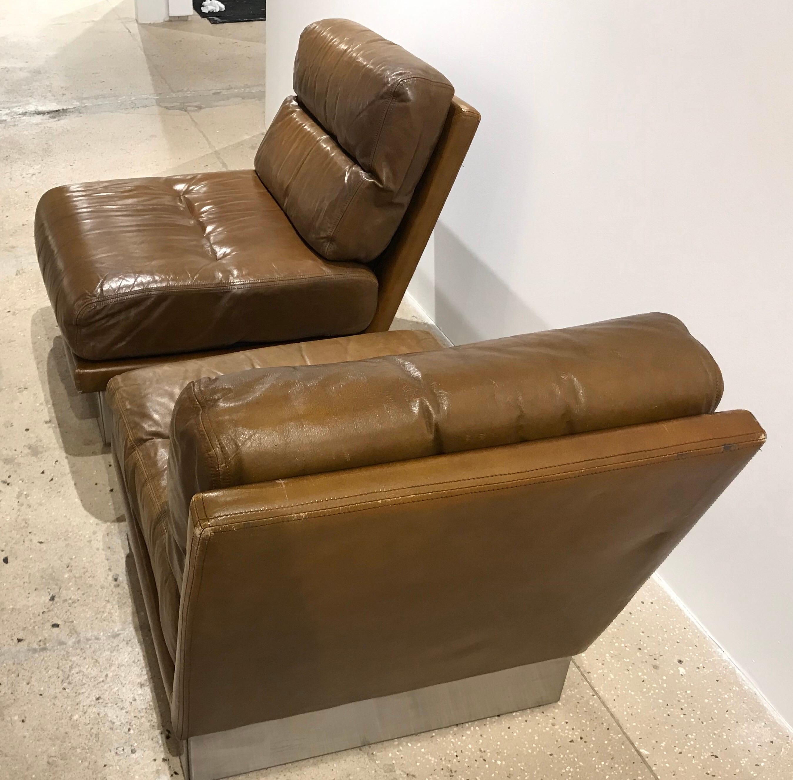 A wonderful pair of 1970s French warm cognac leather lounge chairs by Jacques Charpentier.