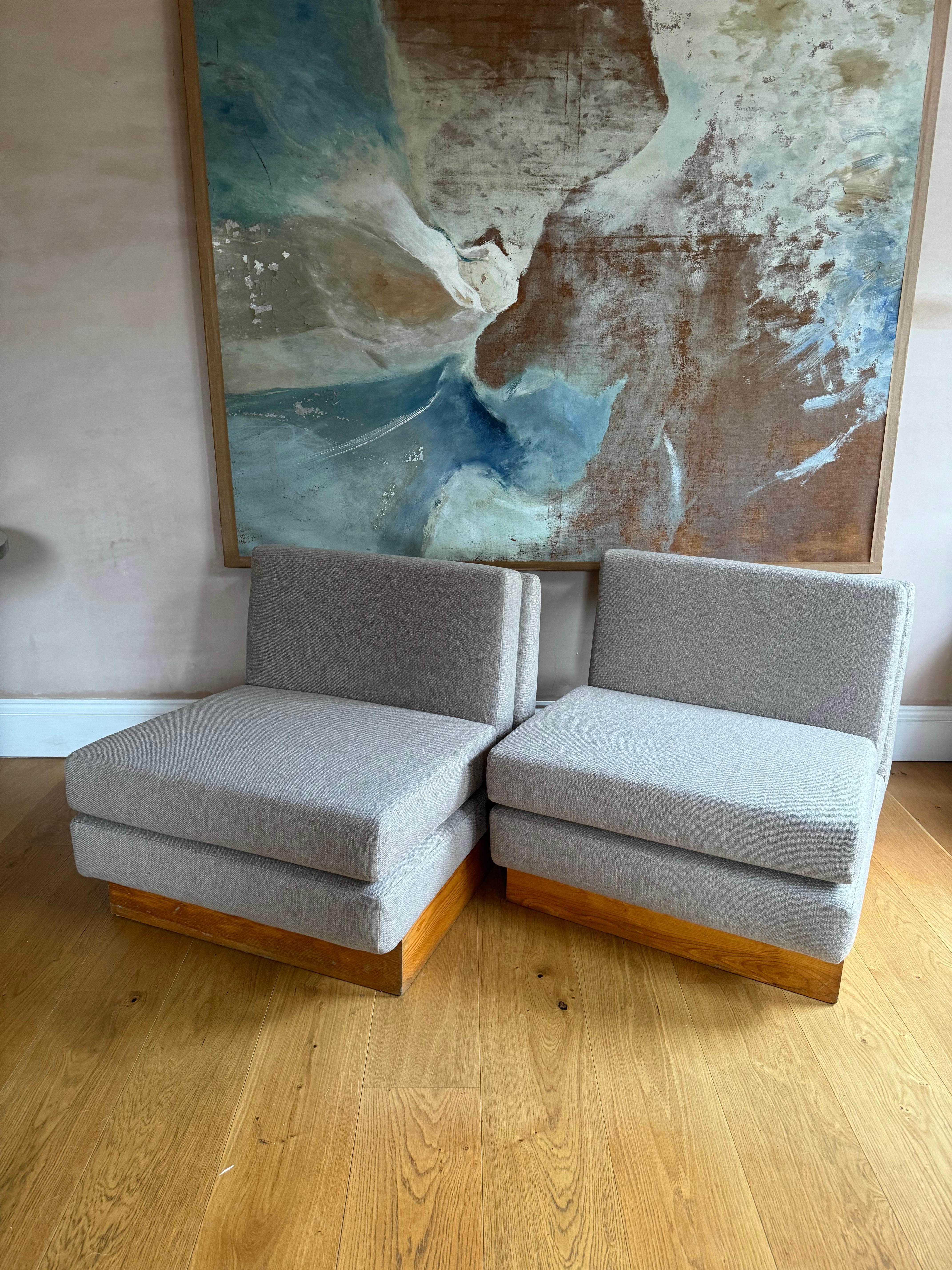 A pair of French 1970’s low slipper chairs in the style of Jacques Charpentier. Reupholstered. Pine bases have some wear and marks to them. 