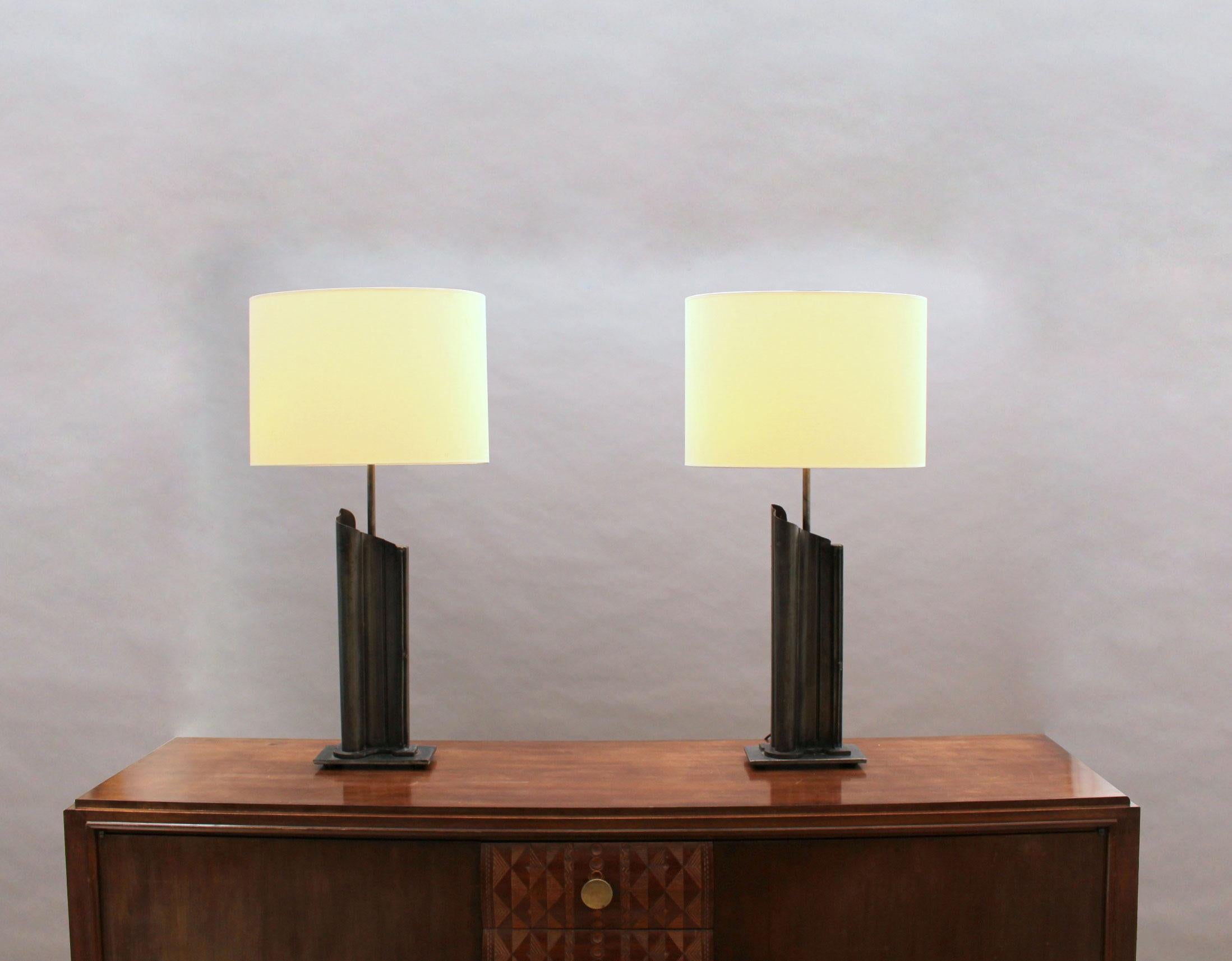 A pair of fine French midcentury patina-ed metal table lamps with their original shades.