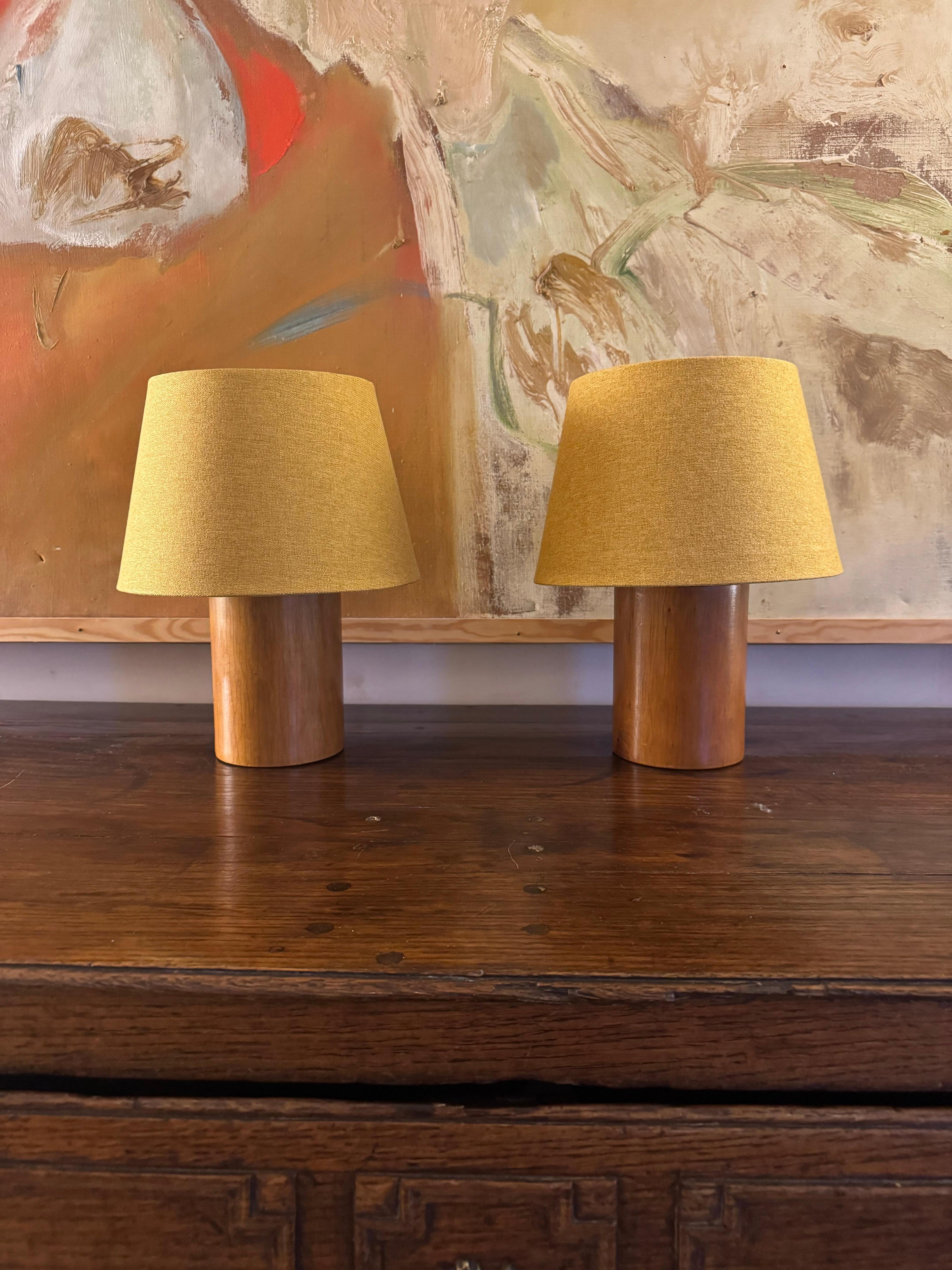 A pair of French polished turned wood lamps. Rewired. Sold with shades.