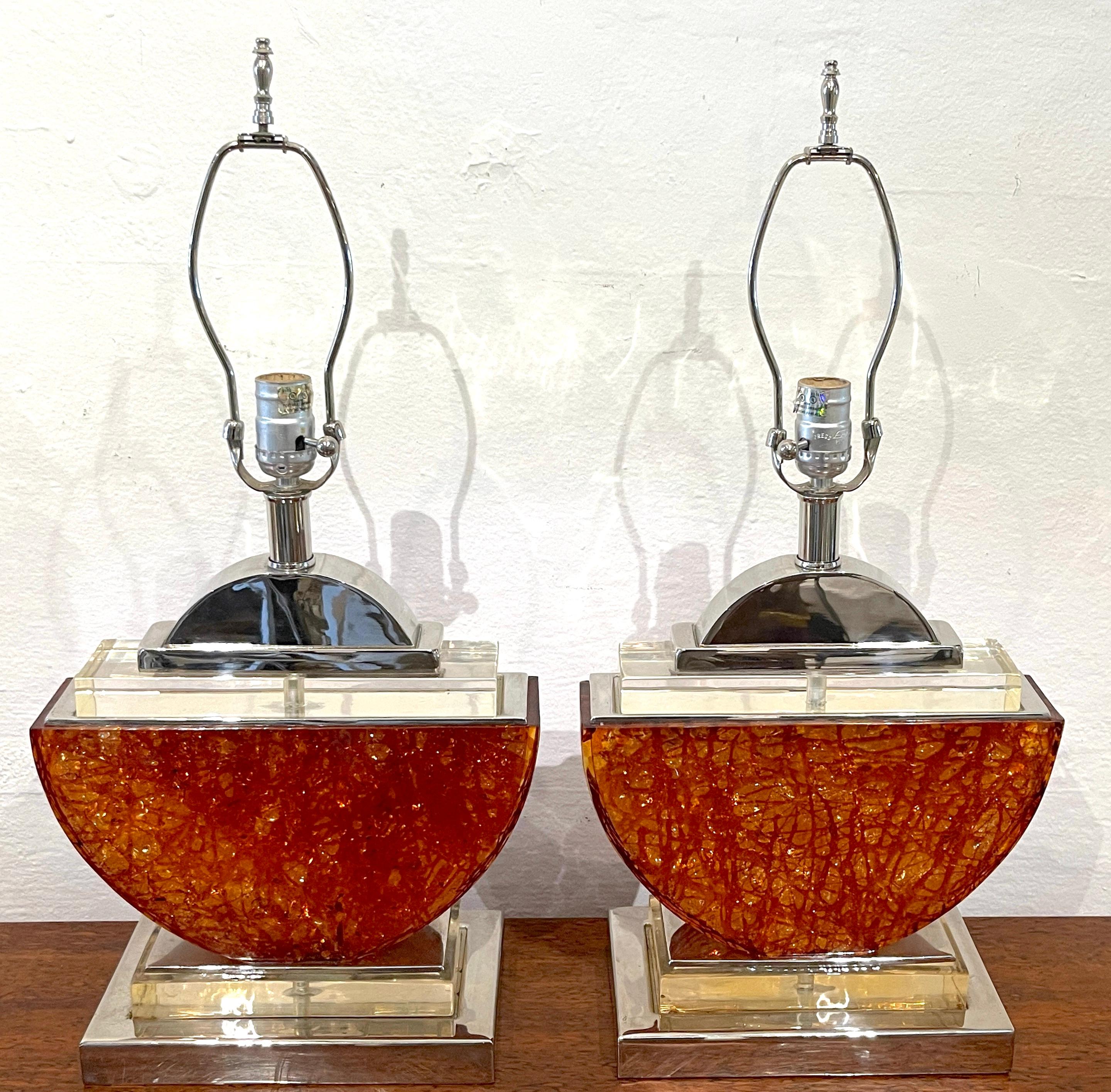 Pair of French 1980s Silver-Plated Bronze & Orange Lucite Half-Moon Table Lamps 
France, 1980s

A fabulous pair of sculptural post -modern/ 1980s iconic style lamps, hard to find. Each sculptural lamp of substantial size and weight, crafted of