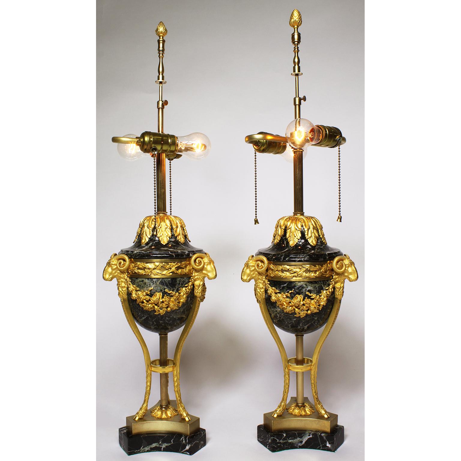 A fine pair of French 19th-20th century Louis XV style gilt bronze (Ormolu) Mounted and Vert Maurin marble (Veined Green Marble) figural urn Lamps. The ovoid variegated green marble bodies, each surmounted with ram's mask monopodia conjoint by