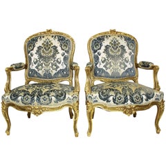 Pair of French 19th-20th Century Louis XV Style Giltwood Carved Rococo Armchairs