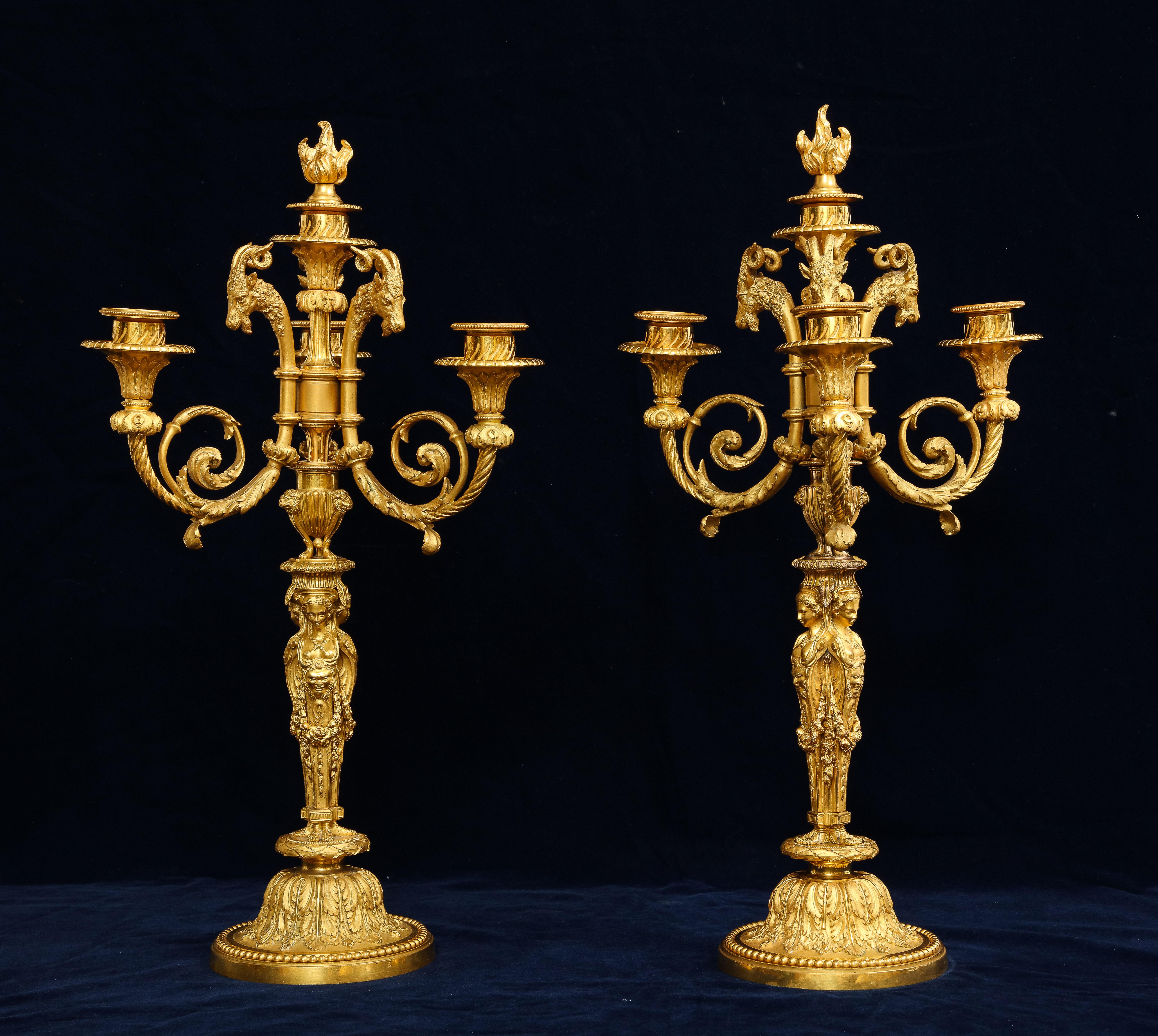 A fabulous pair of French 19th century ormolu figural four light candelabras, after a model by Pierre Gouthiere, After a Design by Jean-Demosthene Dugourc. Each stem with caryatids issuing scrolled branches terminating in marvelous dore bronze