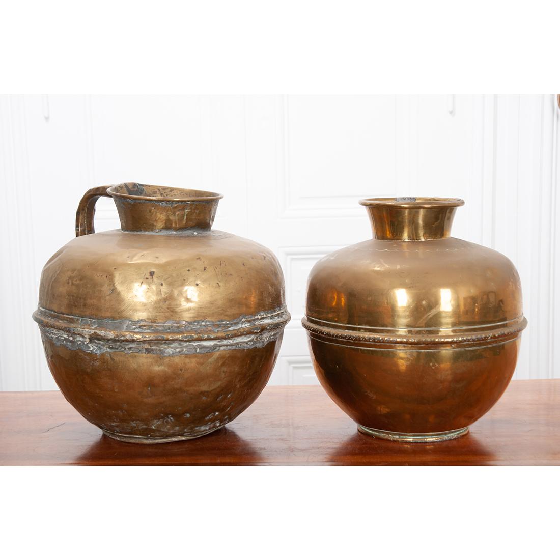 Originating from 19th century France, these would have been used to measure milk quantities in the cheese making process. They show wonderful handmade craftsmanship and were well used as is evident in the old repair work that is visible on the jugs,