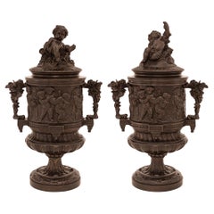 Pair of French 19th century Bronze lidded urns, stamped P.H. Mourey