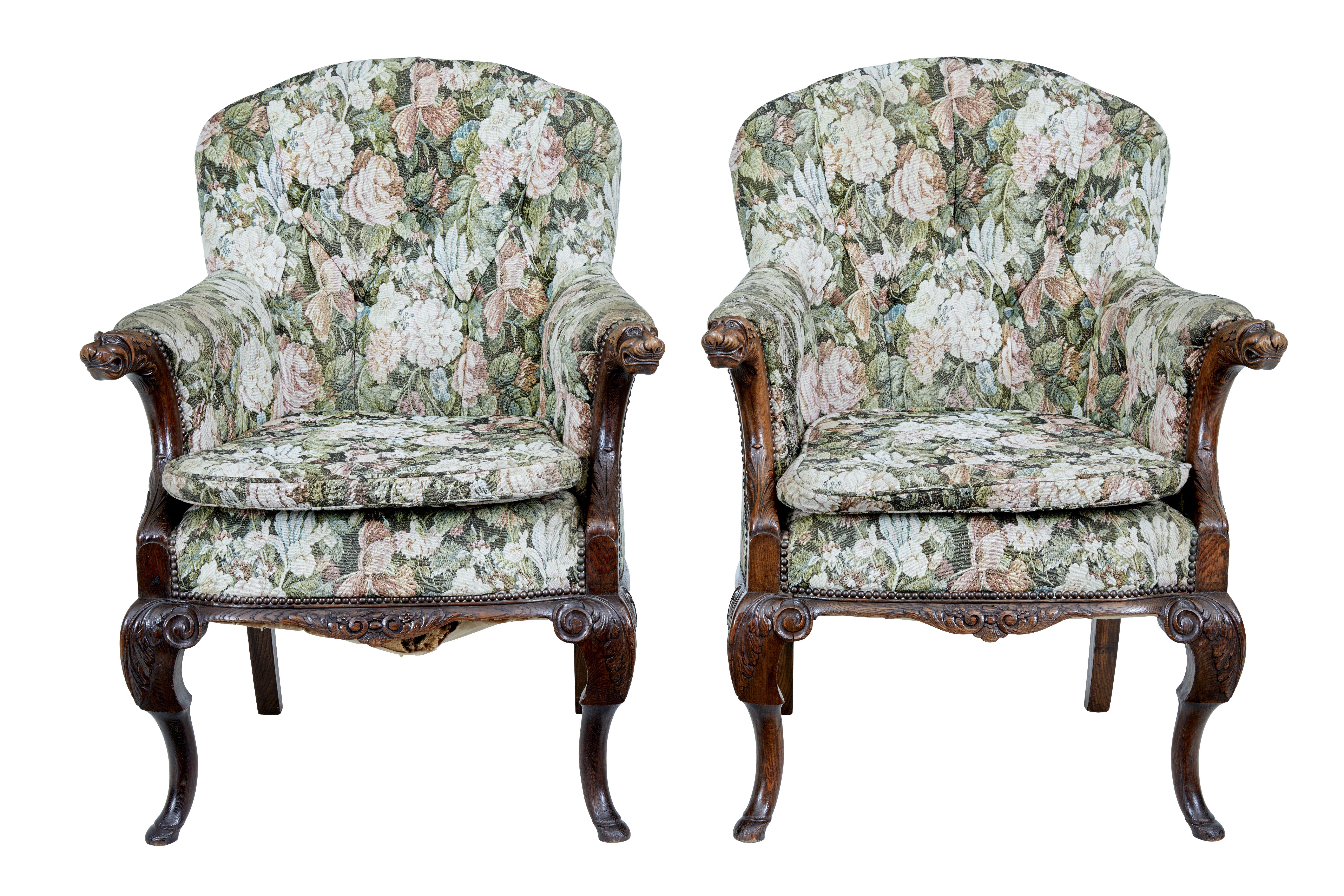 Pair of french 19th century carved oak armchairs circa 1870.

Fine quality pair of profusely carved armchairs. Shaped backs with upholstered arms and a extra seat pad for added comfort.

Carved dogs and acanthus leaves to arms, further carving