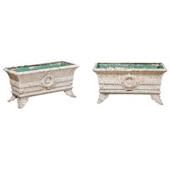 Pair of French 19th Century Cast Iron Planters with Distressed Patina and Wreath