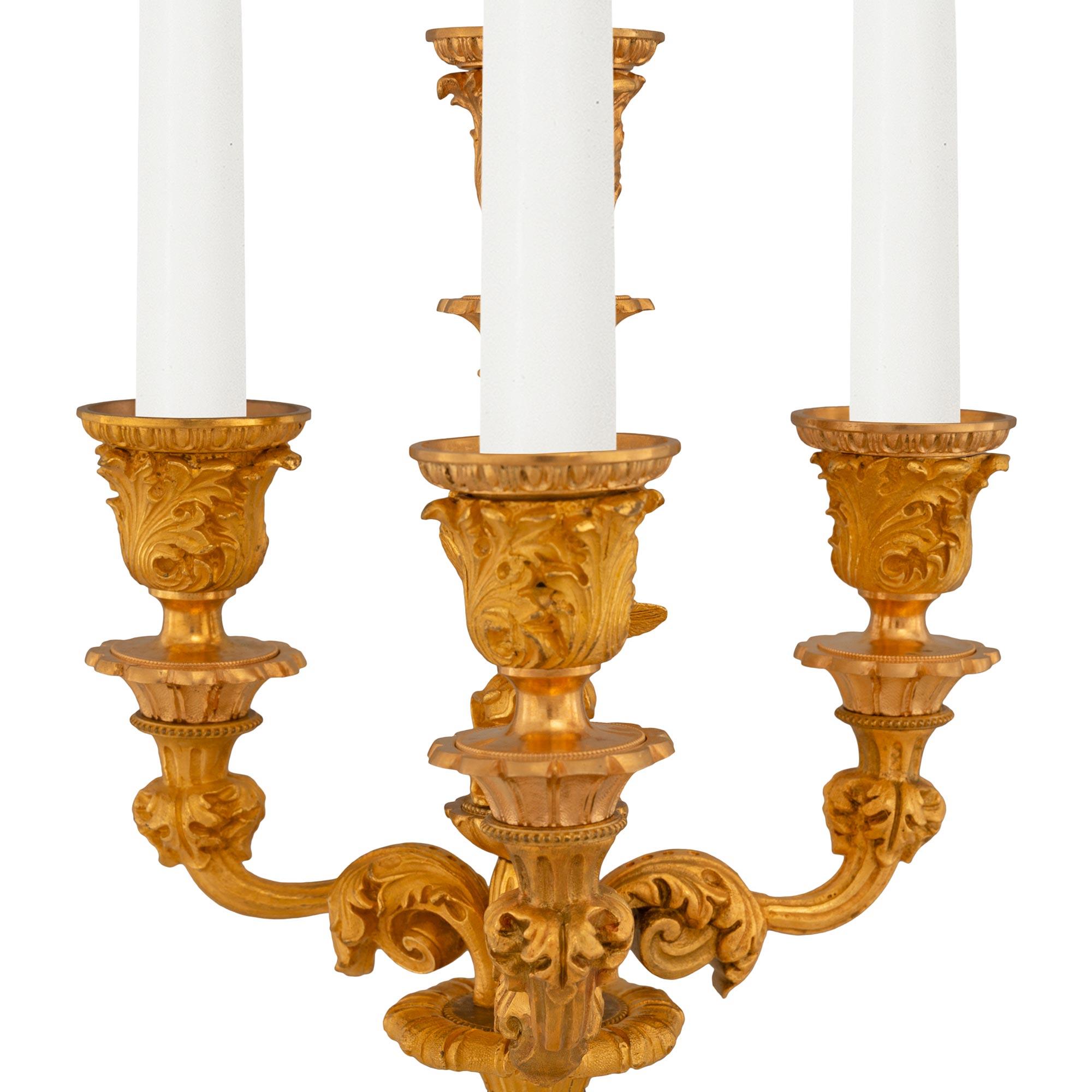 Pair of French 19th Century Charles X Ormolu Four Arm Candelabras In Good Condition For Sale In West Palm Beach, FL