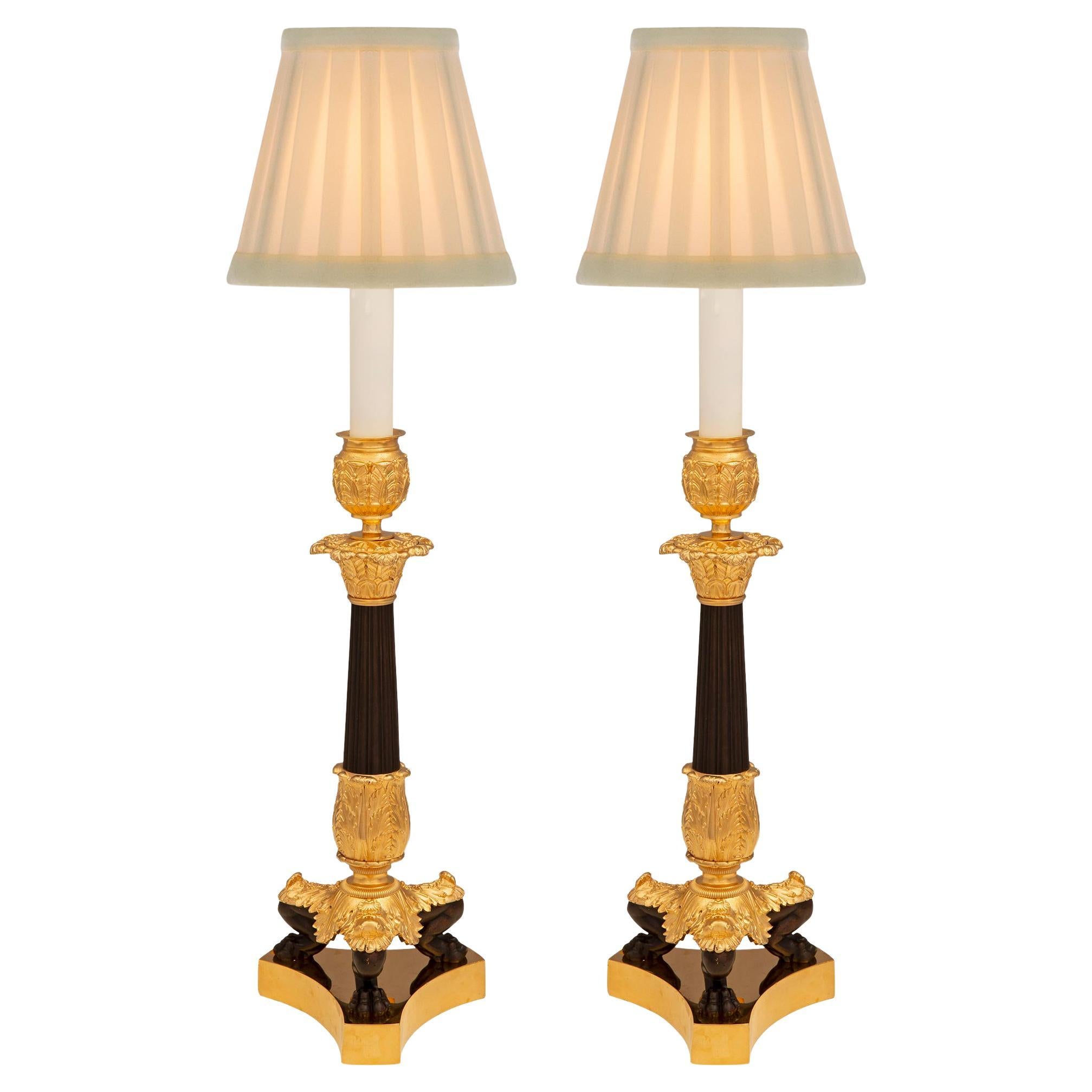 Pair of French 19th Century Charles X Period Bronze and Ormolu Candlestick Lamps For Sale