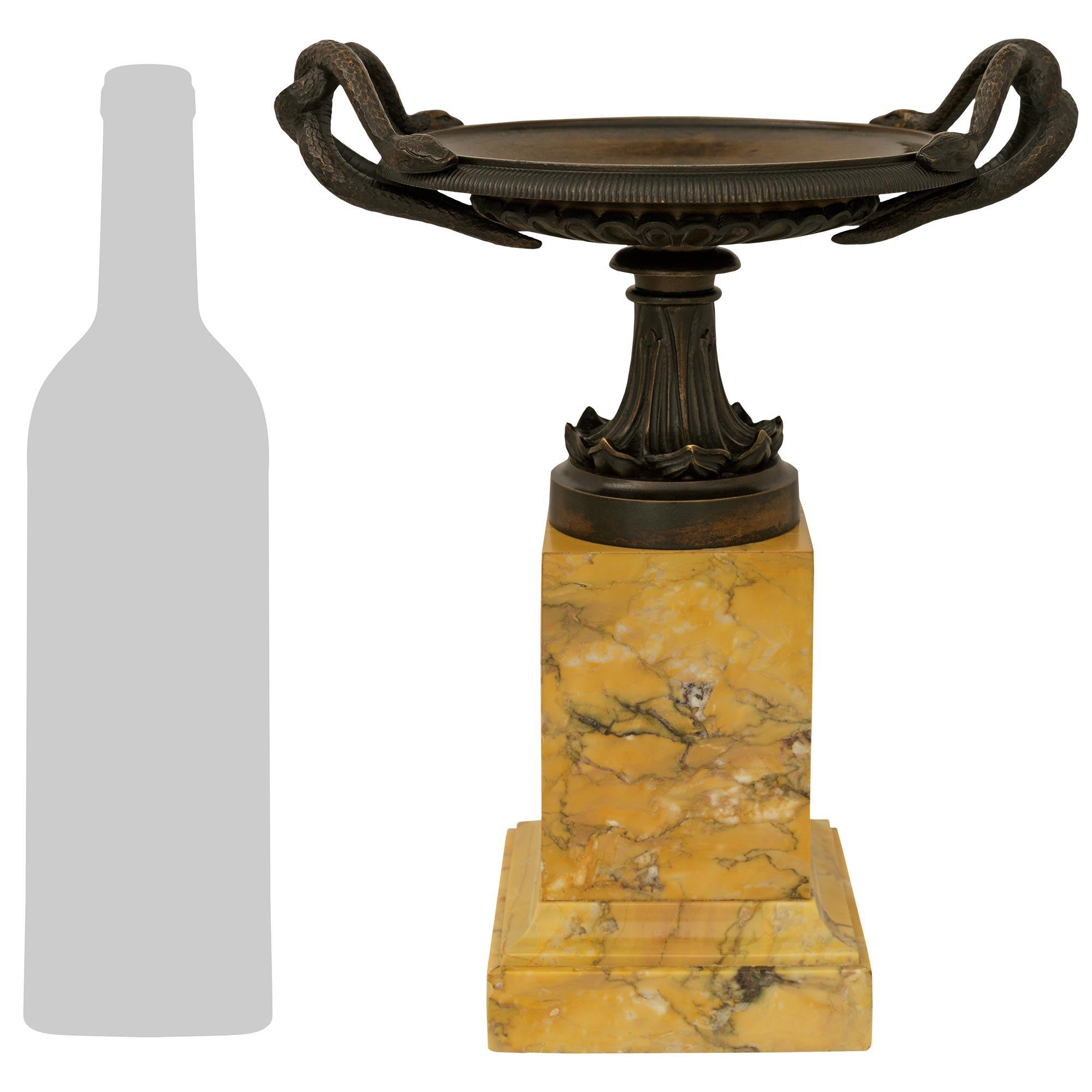 A handsome and high quality pair of French 19th century Charles X Period patinated Bronze and Sienna marble tazzas. Each wonderfully decorative tazza is raised on a square Sienna marble base with a mottled edge below the impressive rectangular